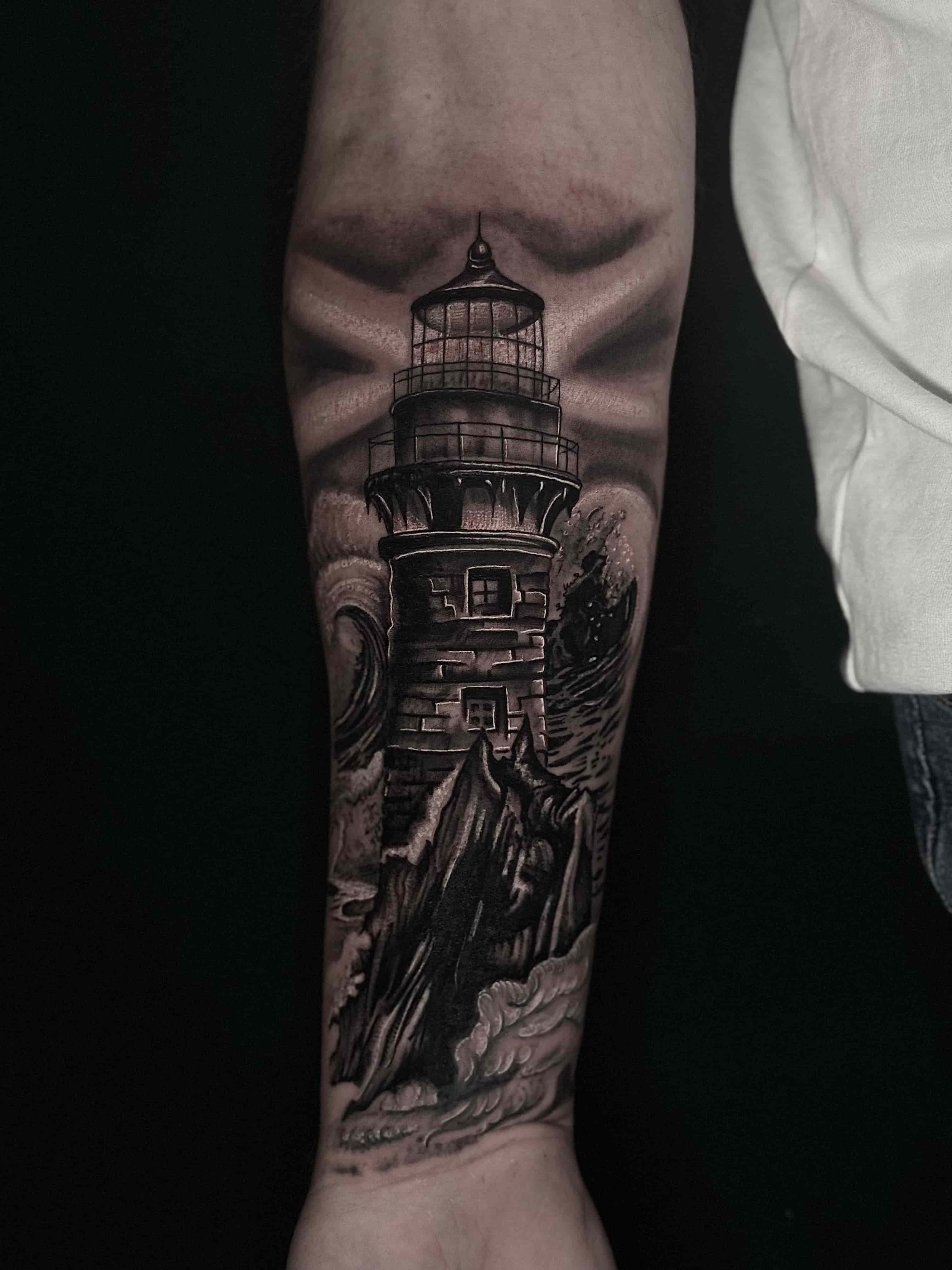 lighthouse realism tattoo forearm