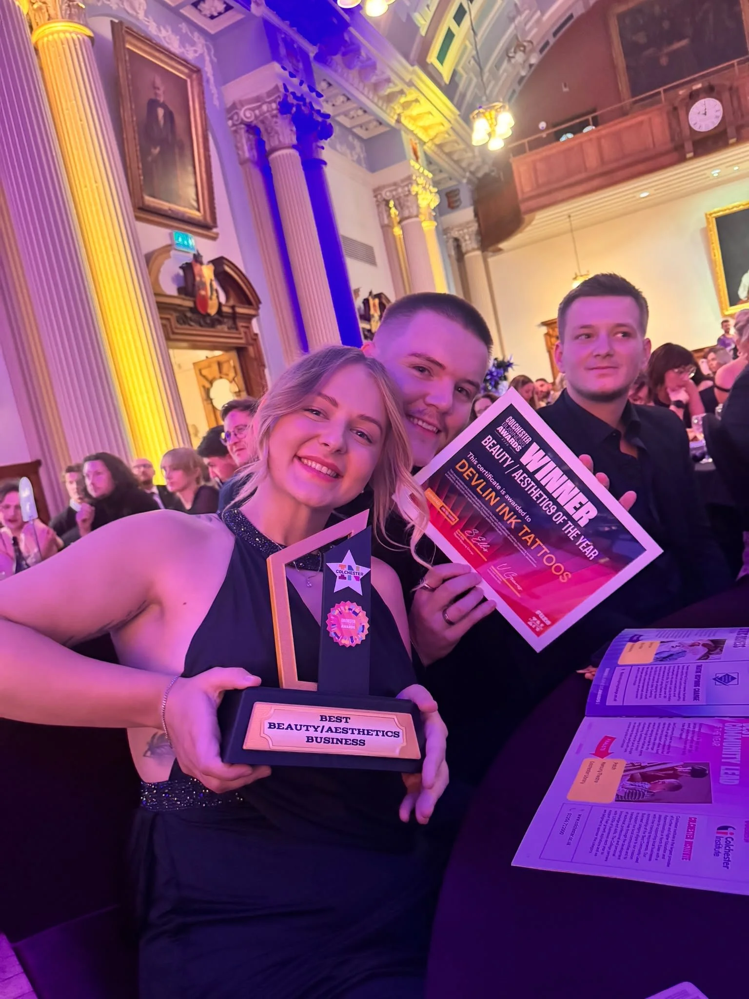 Vicky and Harry Devlin of Devlin Ink Tattoos holding their Beauty & Aesthetics Business of the Year award, Colchester Business Awards