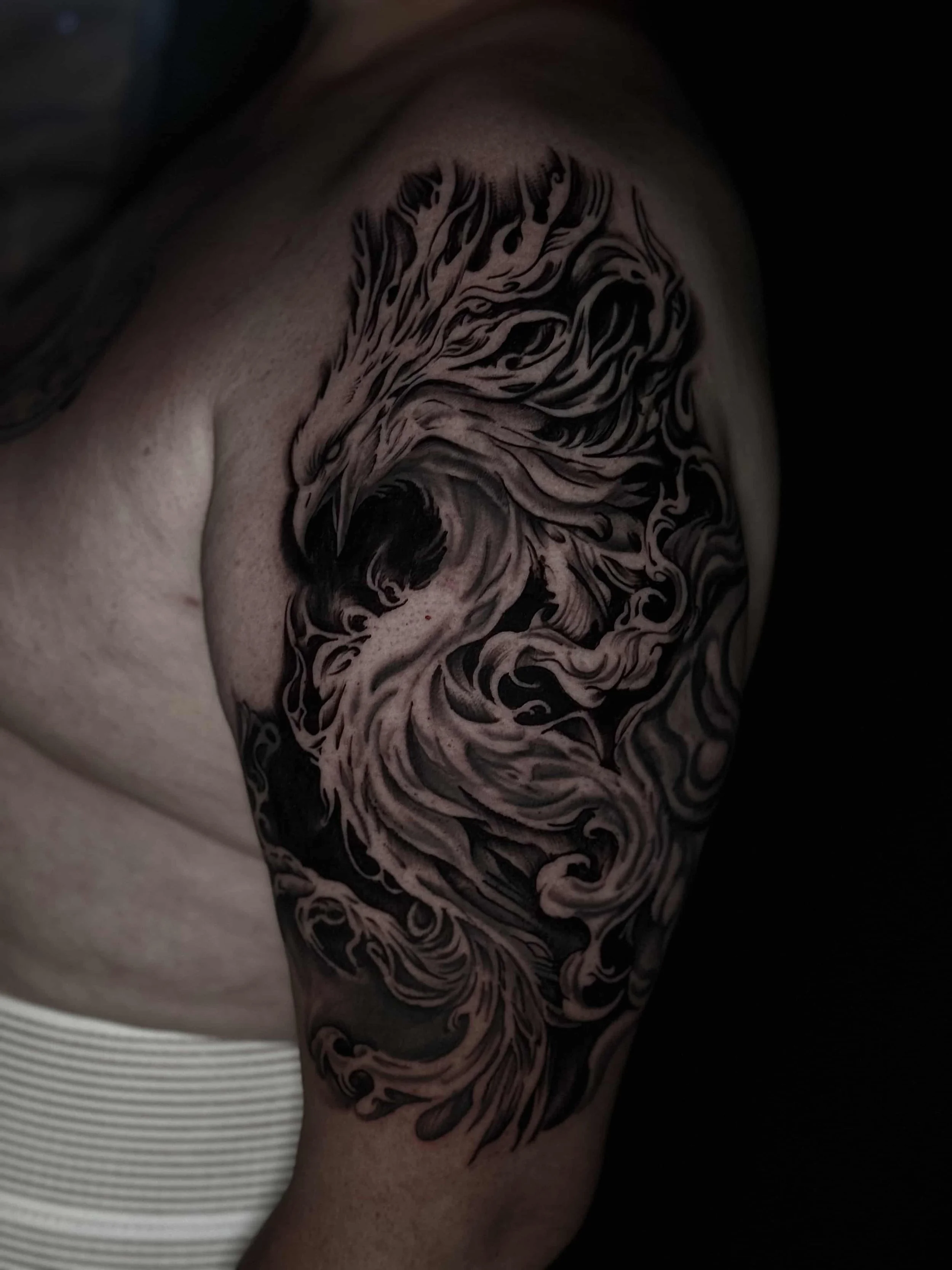 Realism black and grey phoenix tattoo 