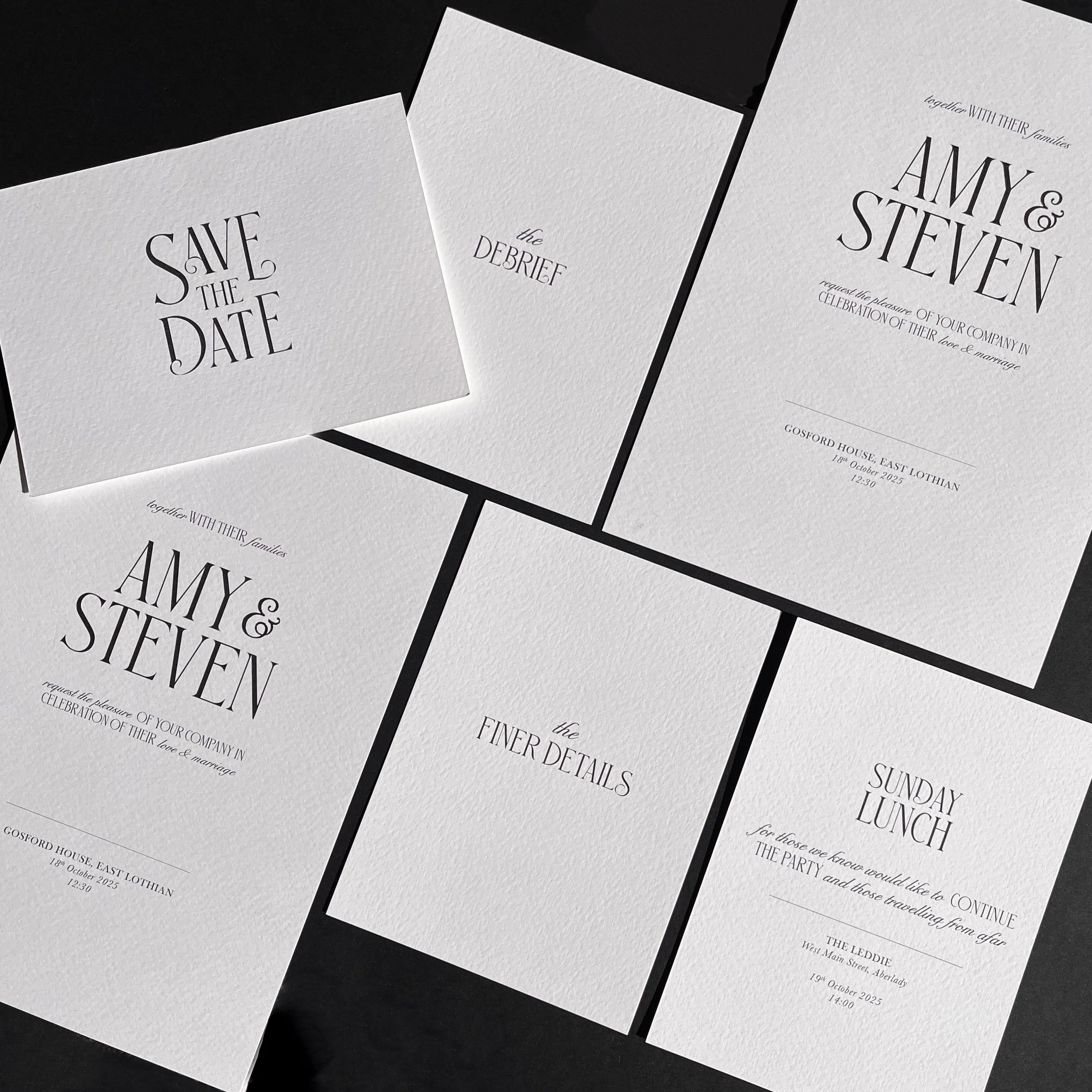 Wedding stationery set including save-the-date, invitations, and details cards in white textured paper with black text.