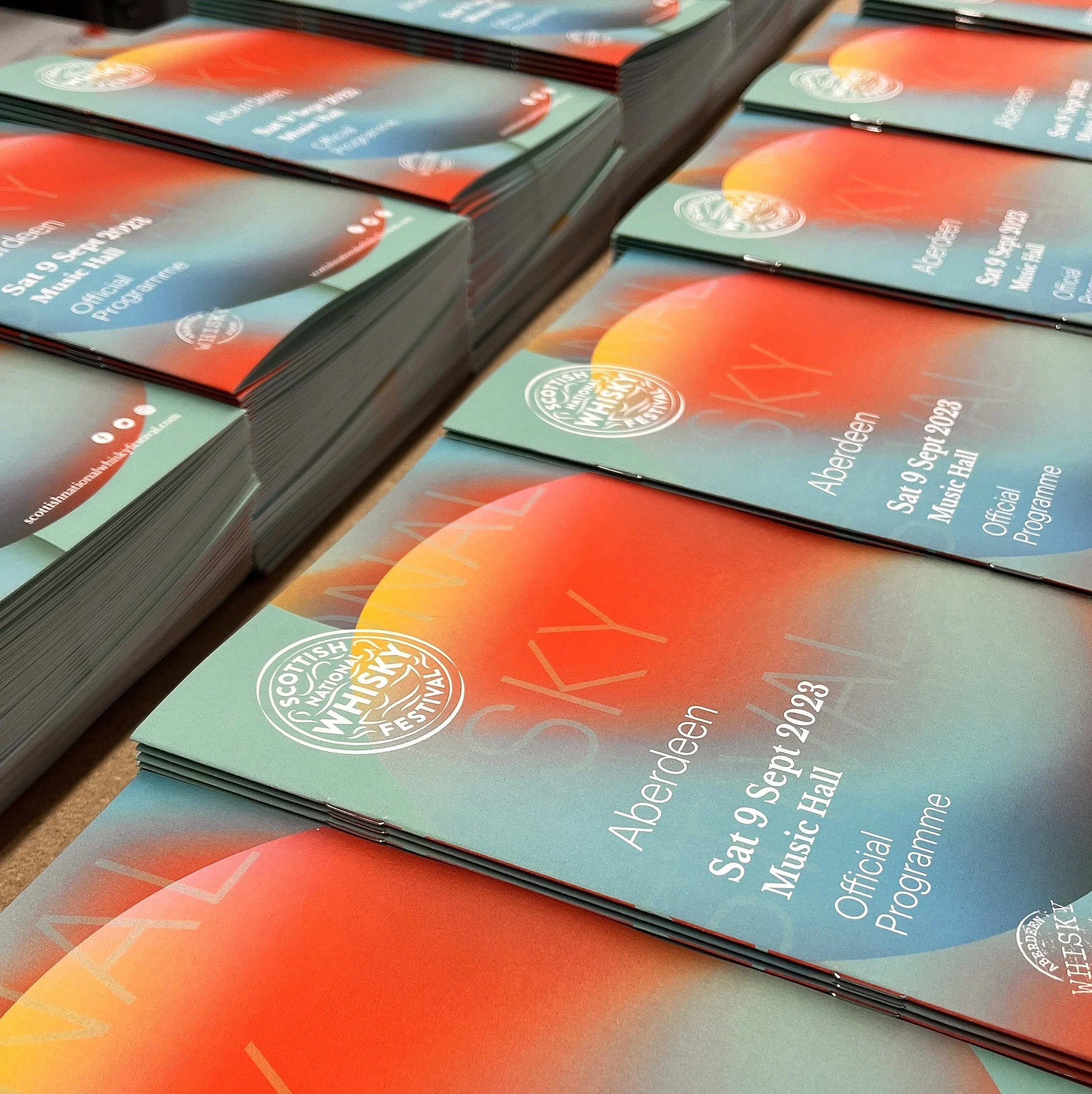 Multiple copies of the official program for the Scottish National Whisky Festival, held in Aberdeen on Saturday, September 9, 2023, at Music Hall.