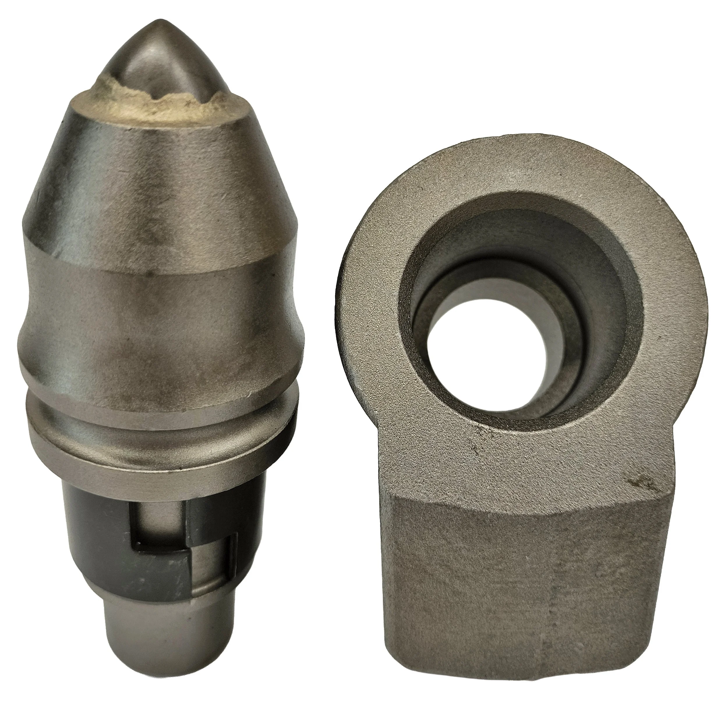 Close-up of metal machine parts, including a conical tip, a cylindrical piece, and a hollow ring, all with a matte metallic finish.