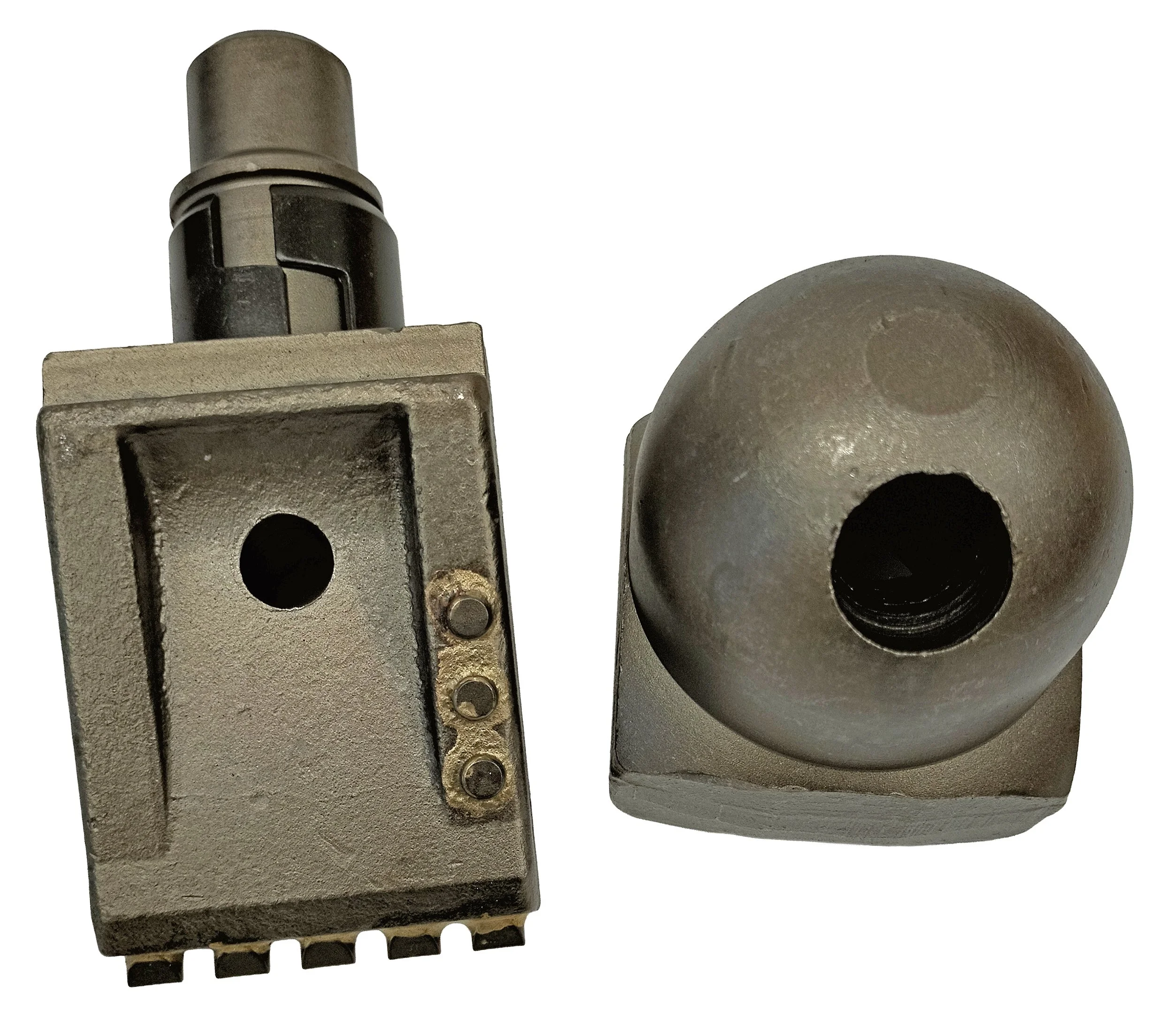 Close-up of a metallic auger tooth and holder used for industrial drilling. The items shown are the BFZ 100 tooth and holder.