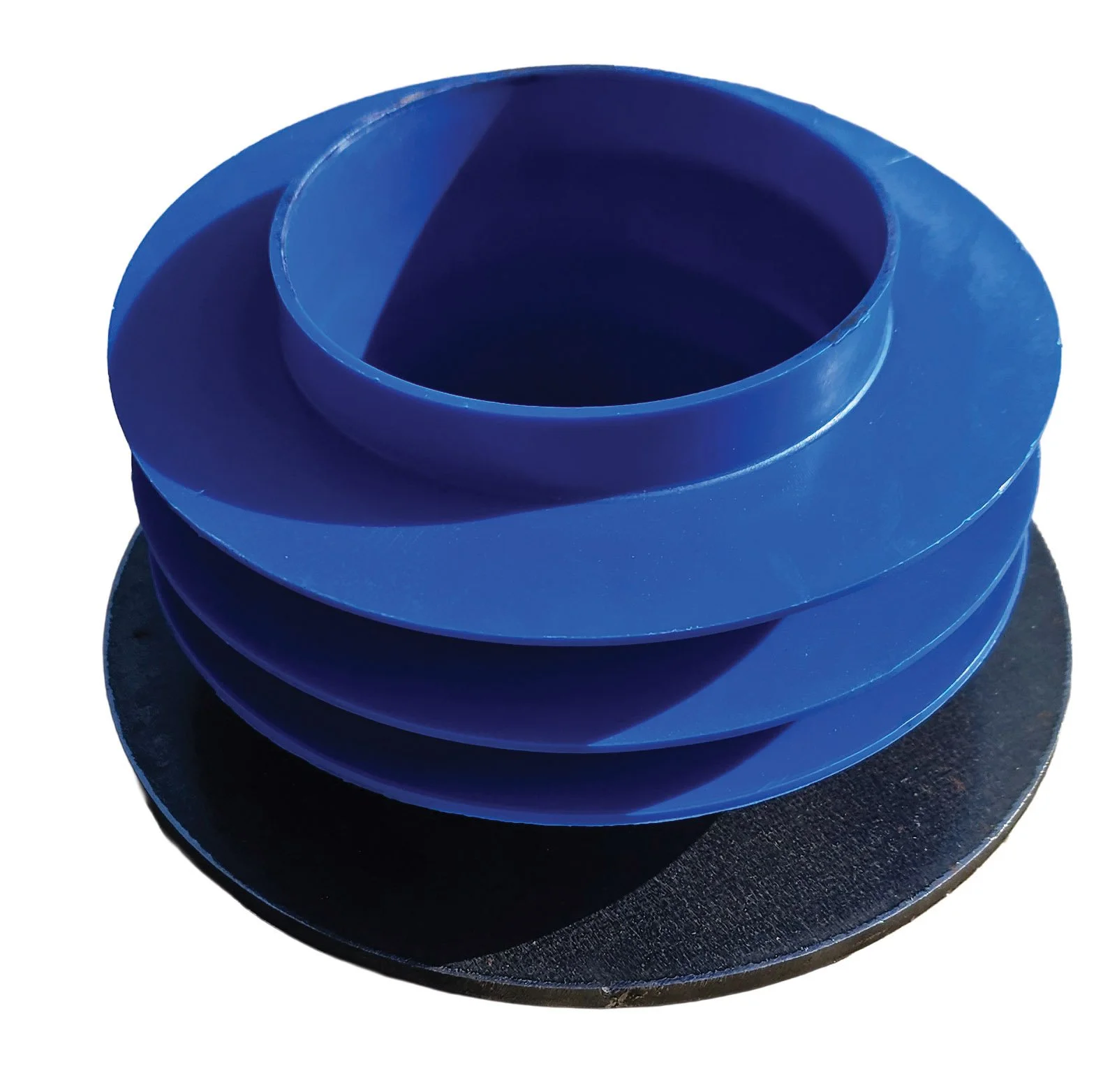 Blue rubber coupling with multiple ridges, placed on a black circular surface.