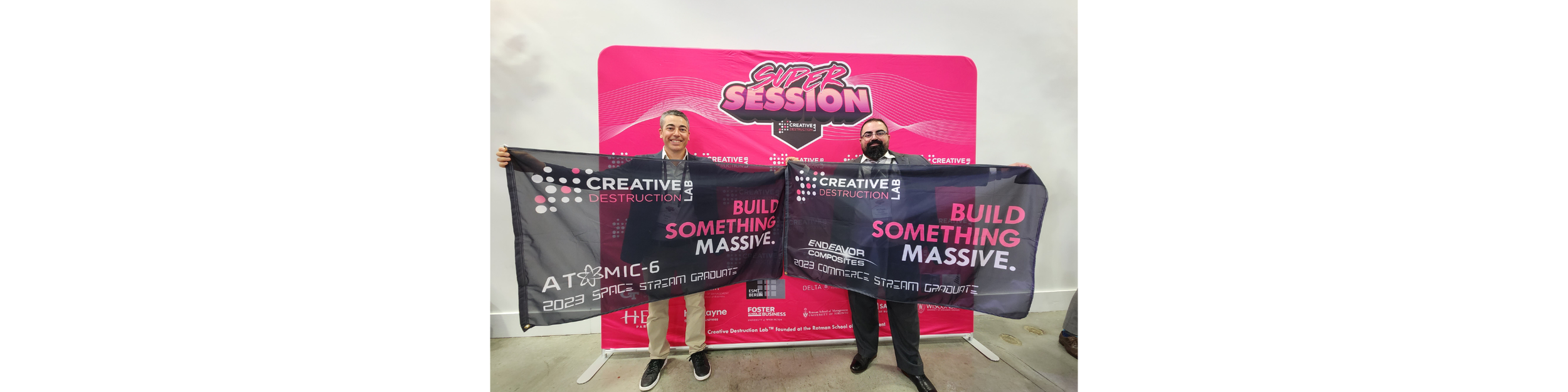 Atomic-6 President & CEO Trevor Smith and fellow Atomic-6 Co-Founder & Endeavor Composites CEO Hicham Ghossein proudly represent their respective flags as graduates of the CDL program.