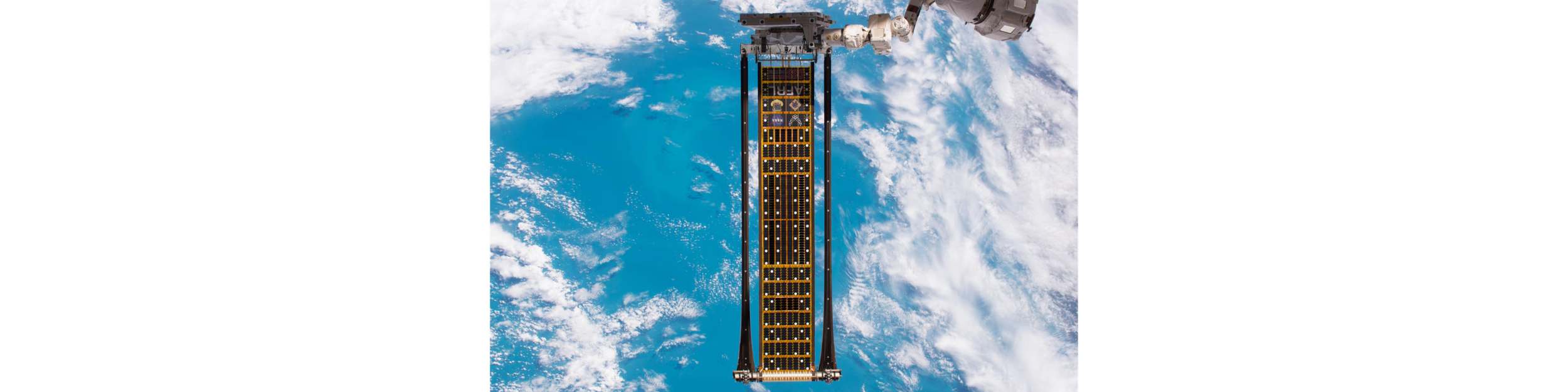  Credit: Air Force Research Lab. Air Force Research Laboratory’s Roll-Out Solar Array (ROSA) developed in partnership with Deployable Space Systems in flight-testing on the International Space Station. The booms on either end represent the technology Atomic-6 will be working on during the Phase II project. 
