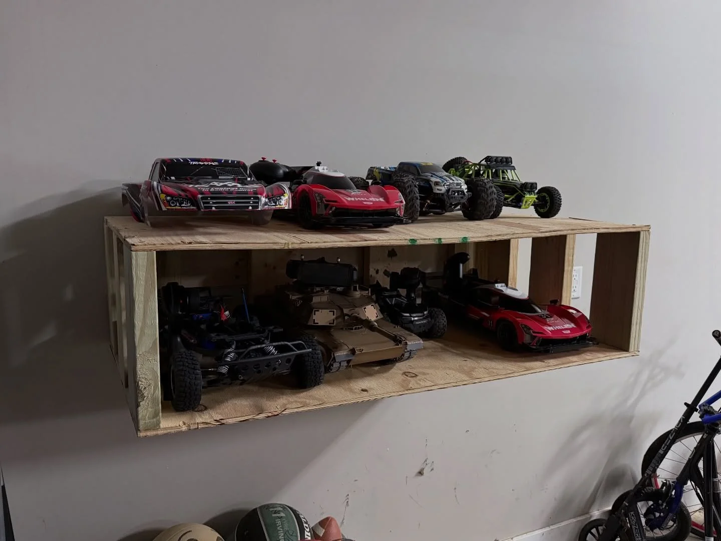 A quick scrap wood project with my son. He needed somewhere to store all the RC Cars and I had some random wood laying around. He helped build and hang it!