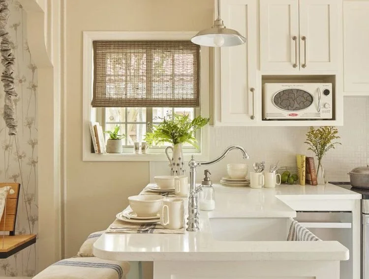 8 Paint Colors Designers Use To Make A Small Kitchen Feel Bigger