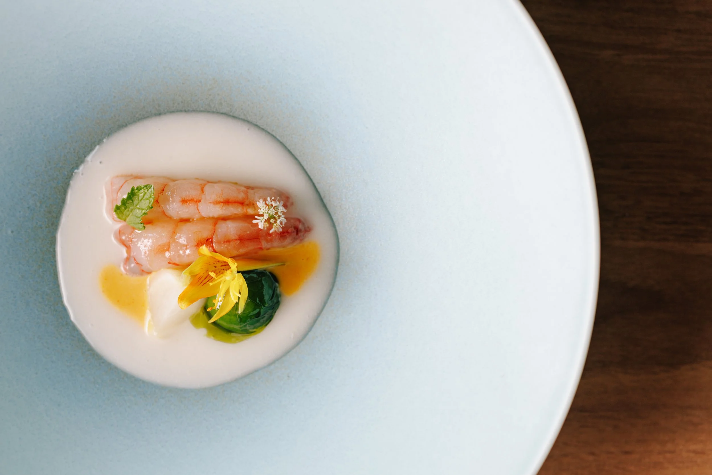 Clean shrimp dish on blue plate
