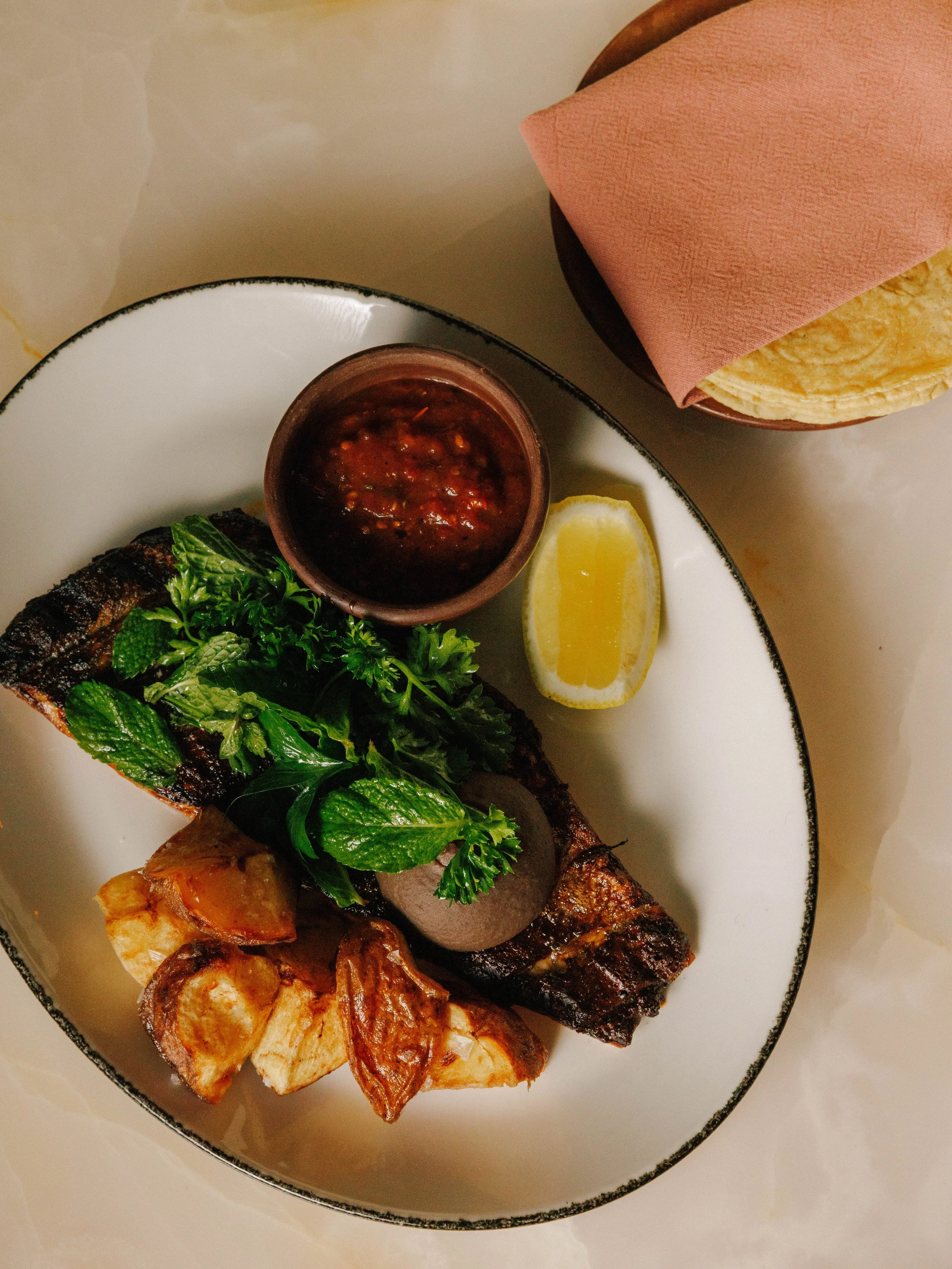 Charred fish dish