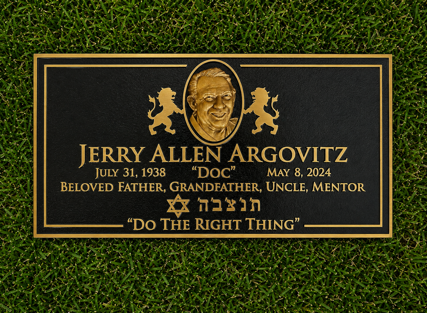 Memorial plaque for Jerry Allen Argovitz, born July 31, 1938, died May 8, 2024, on a grassy background. The plaque features an engraved portrait of Jerry, two lions flanking the portrait, a Star of David, and Hebrew inscriptions. Text includes his full name, dates, and titles such as 'Beloved Father, Grandfather, Uncle, Mentor,' with the phrase 'Do The Right Thing' at the bottom.