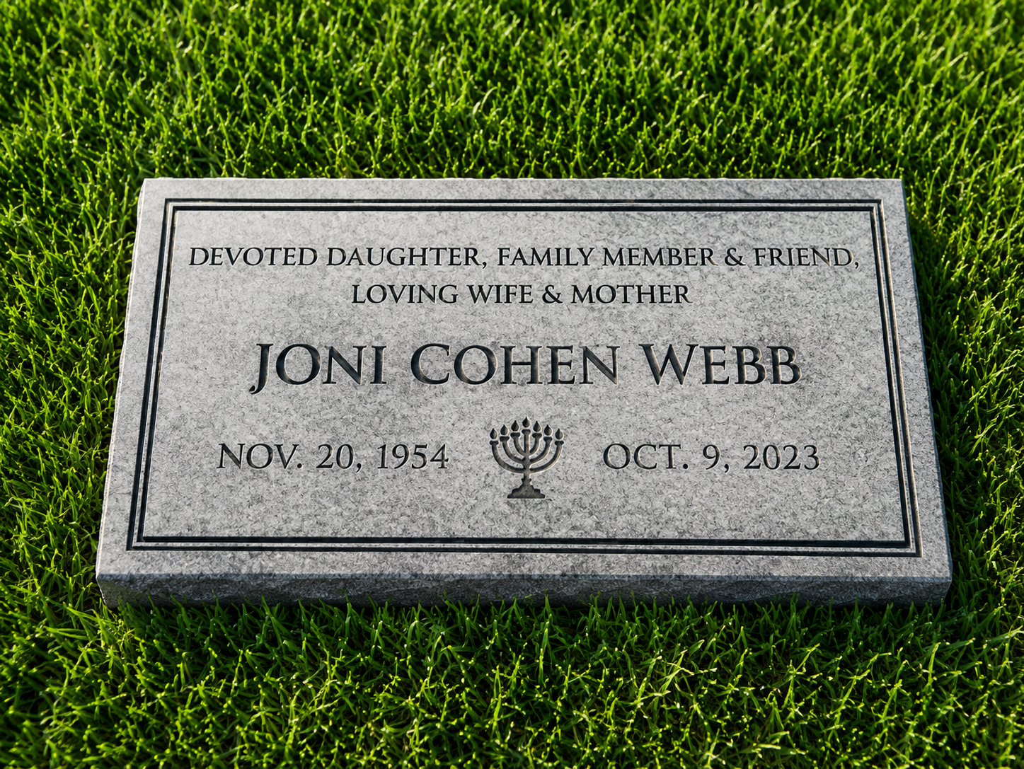 Gravestone for Joni Cohen Webb with her birth and death dates, a menorah symbol, and tribute text.