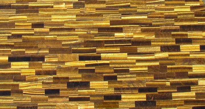 Close-up of a decorative surface made of small rectangular wooden tiles arranged in a pattern.