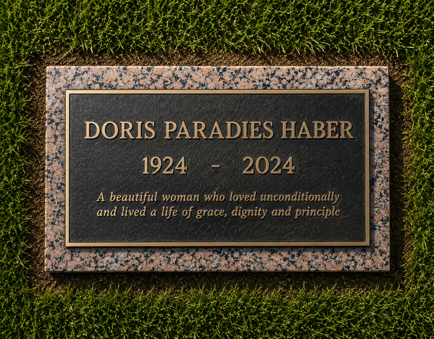 Gravestone memorial for Doris Paradies Haber, 1924-2024, placed on a grassy lawn.