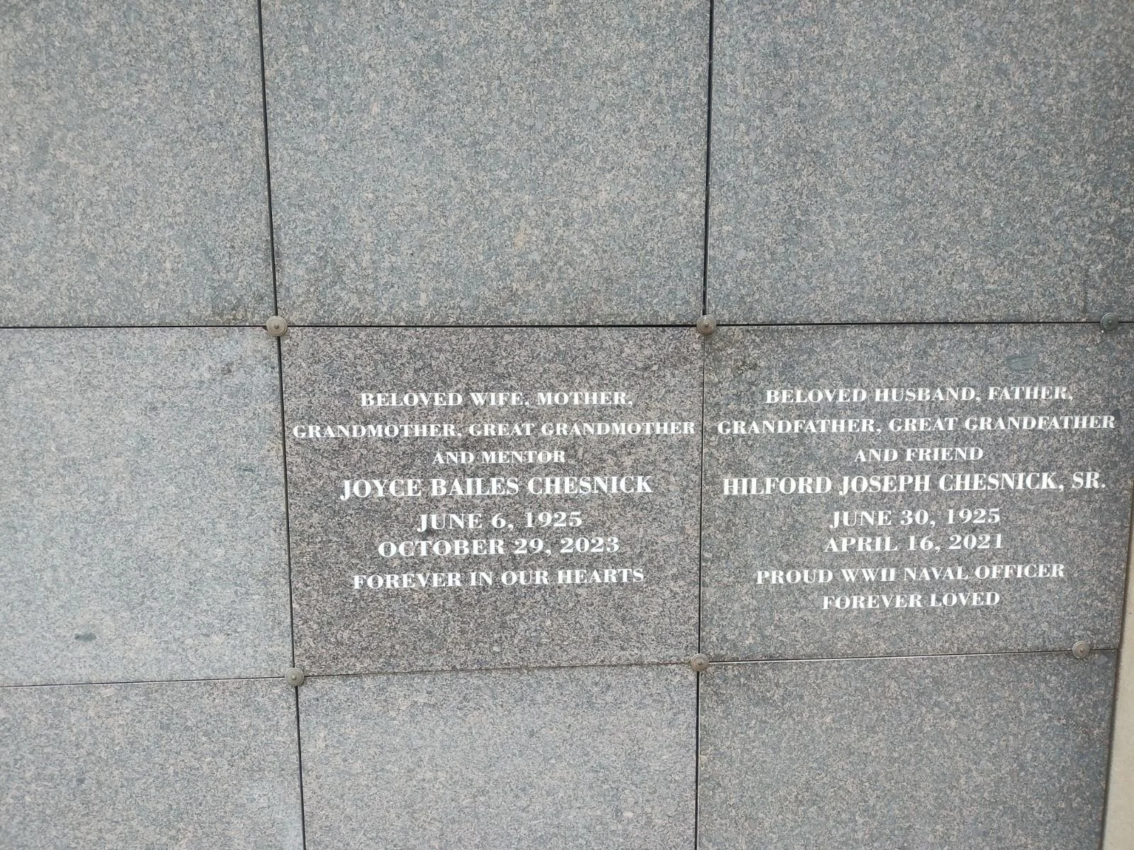 Memorial plaque with inscriptions dedicated to Joyce Bailes Chesnick and Hilford Joseph Chesnick, Sr., with dates of birth and death, and messages of remembrance.