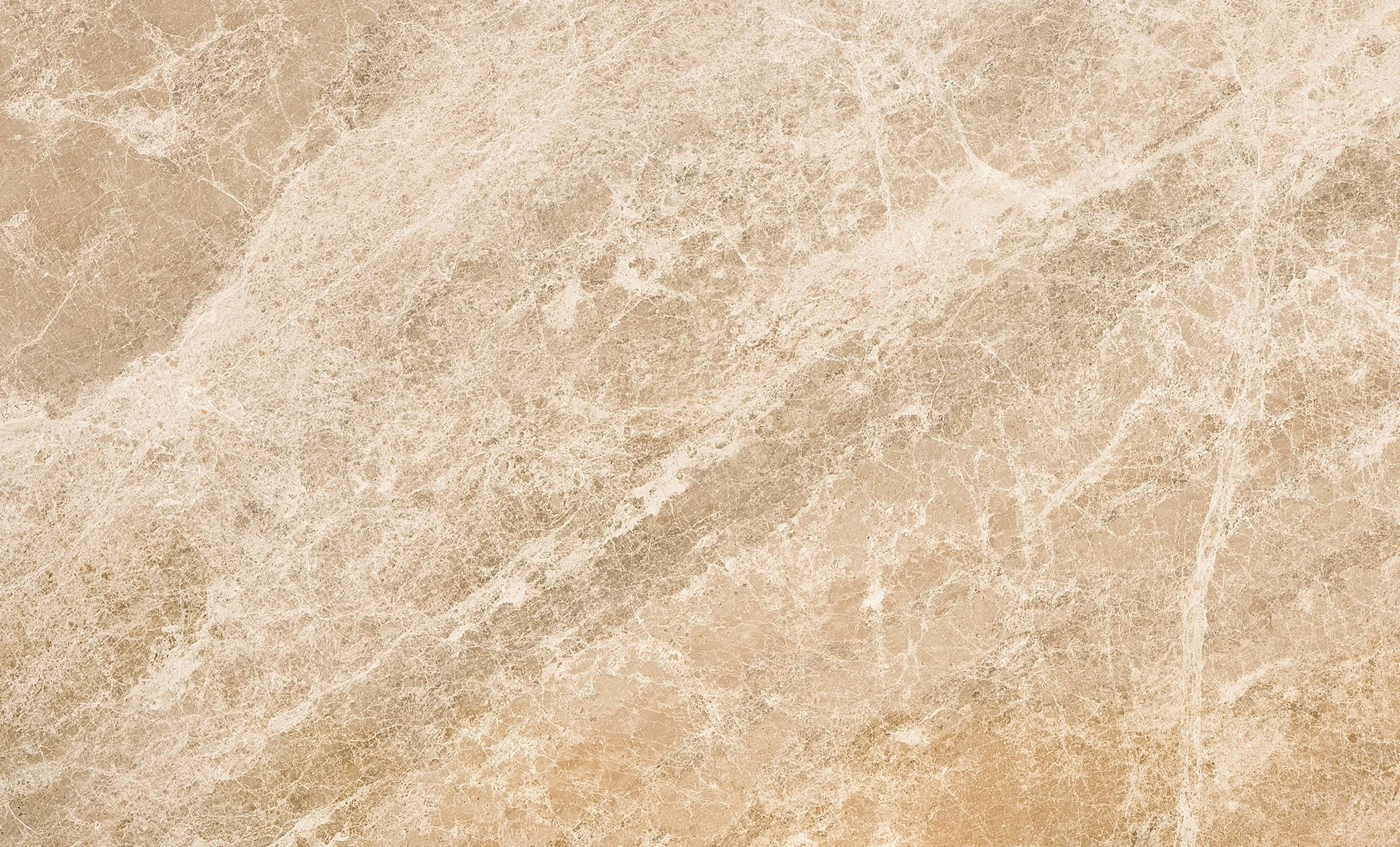Close-up view of beige marble surface with white and darker beige veining.