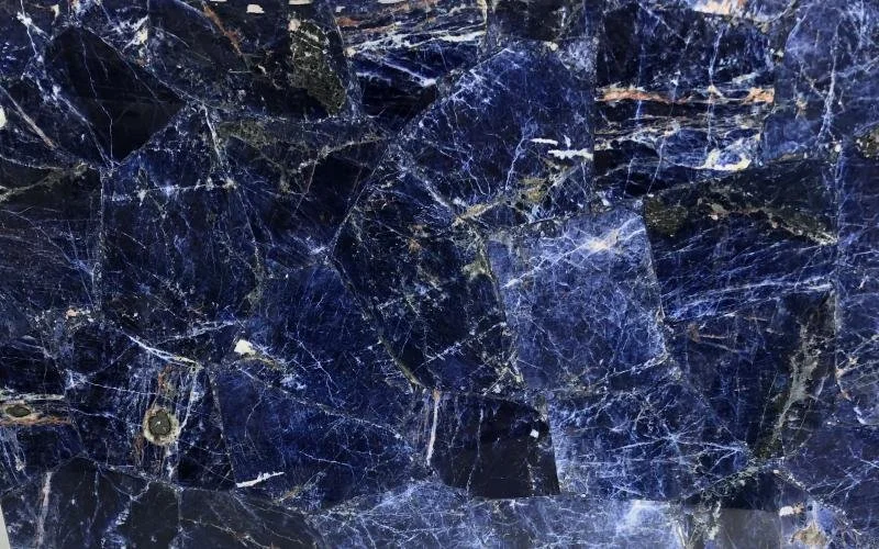 Close-up of dark blue marble with white veining.