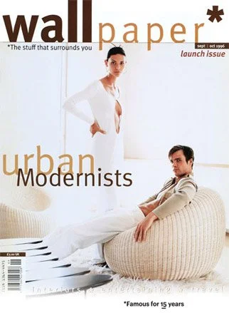 Cover of Wall Paper magazine featuring a woman and man in modern, urban clothing in a minimalist, white interior setting.