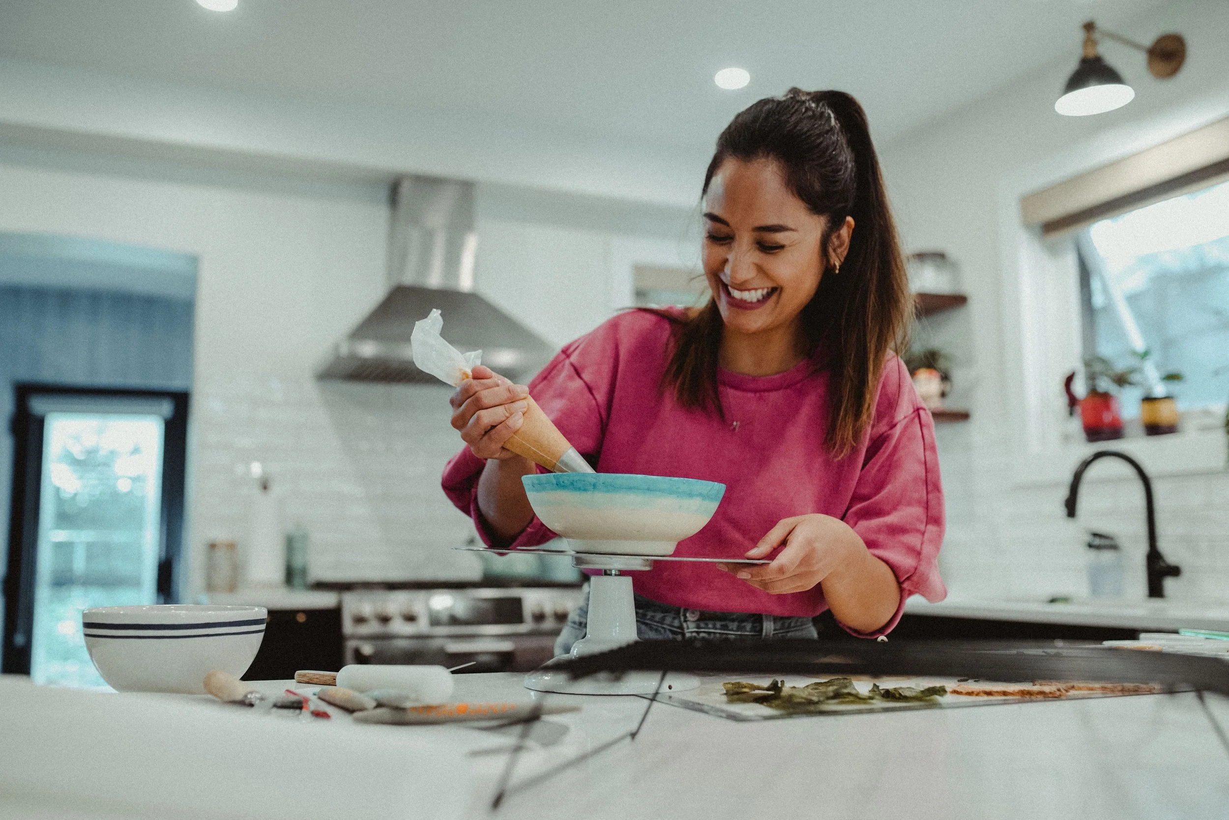 April Julian creating ramen cake in her home kitchen