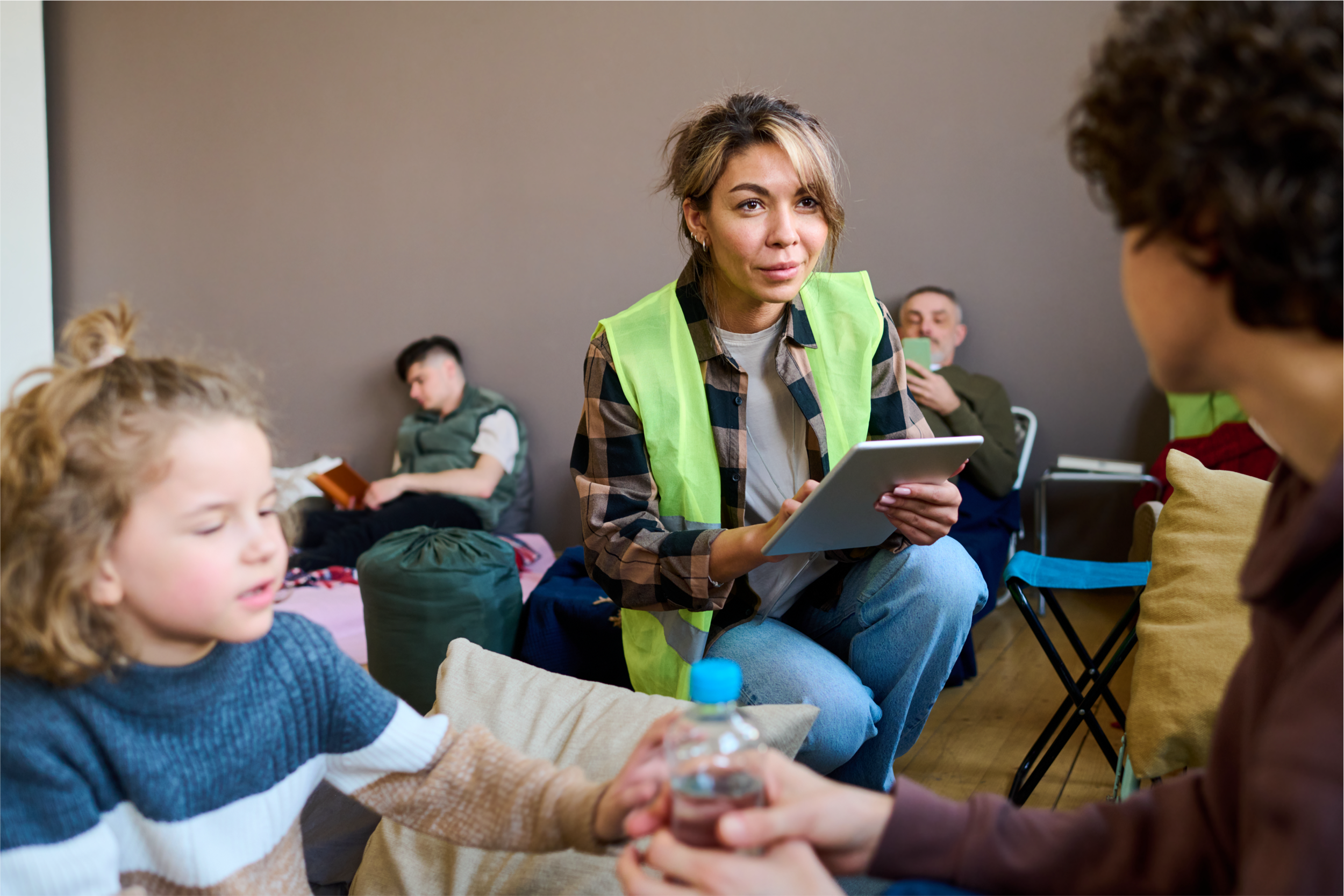 woman interviewing adult woman and child