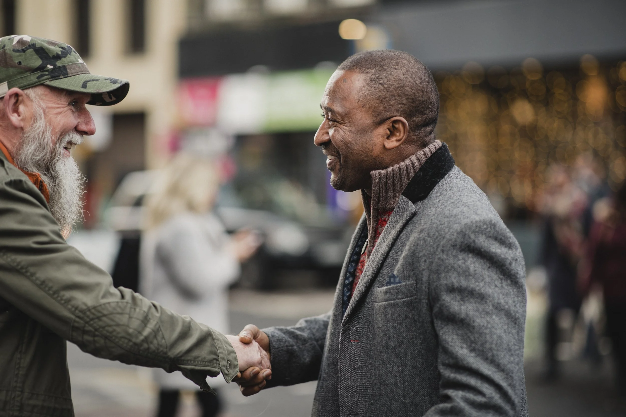 two men greeting each other