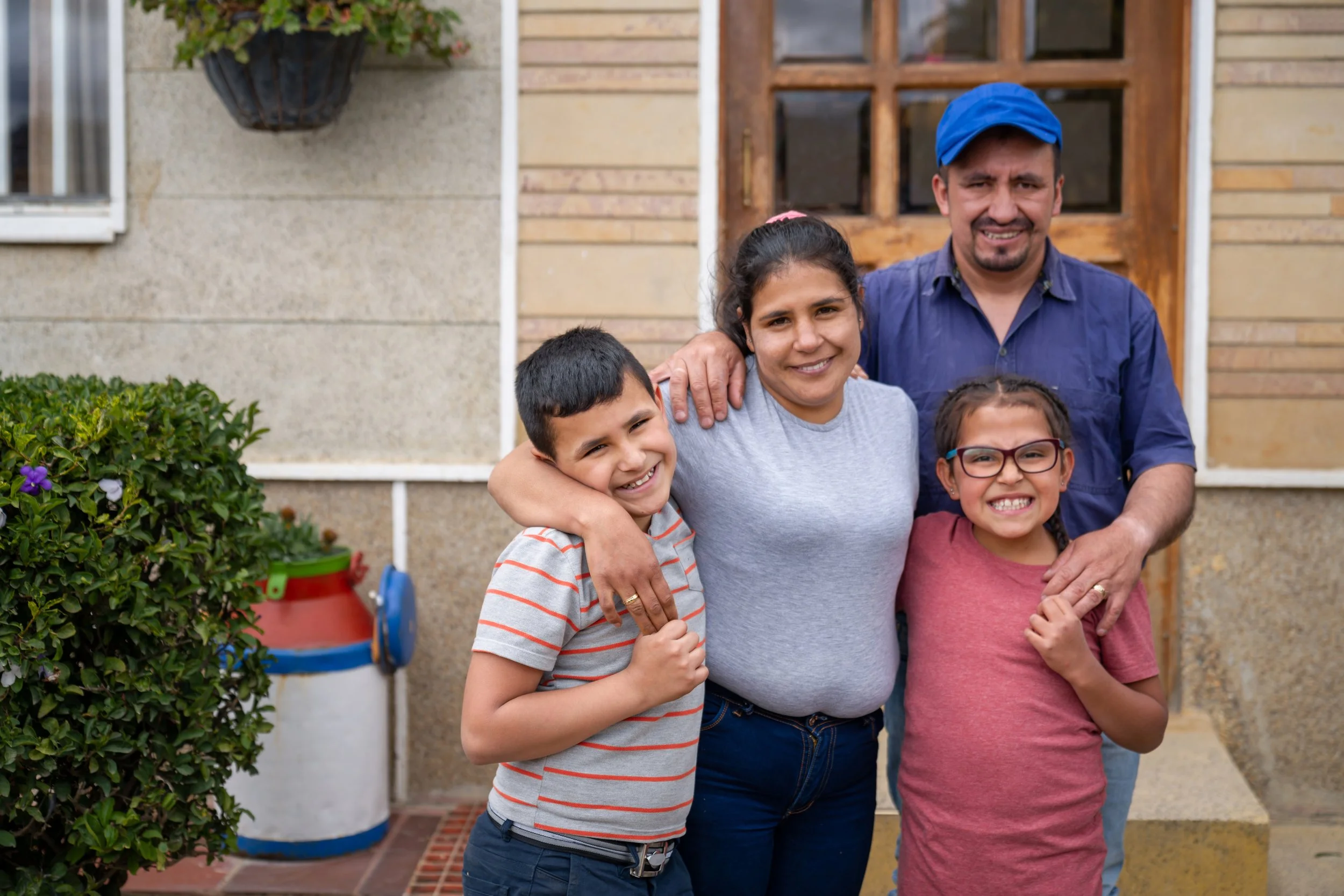 happy family in front of door