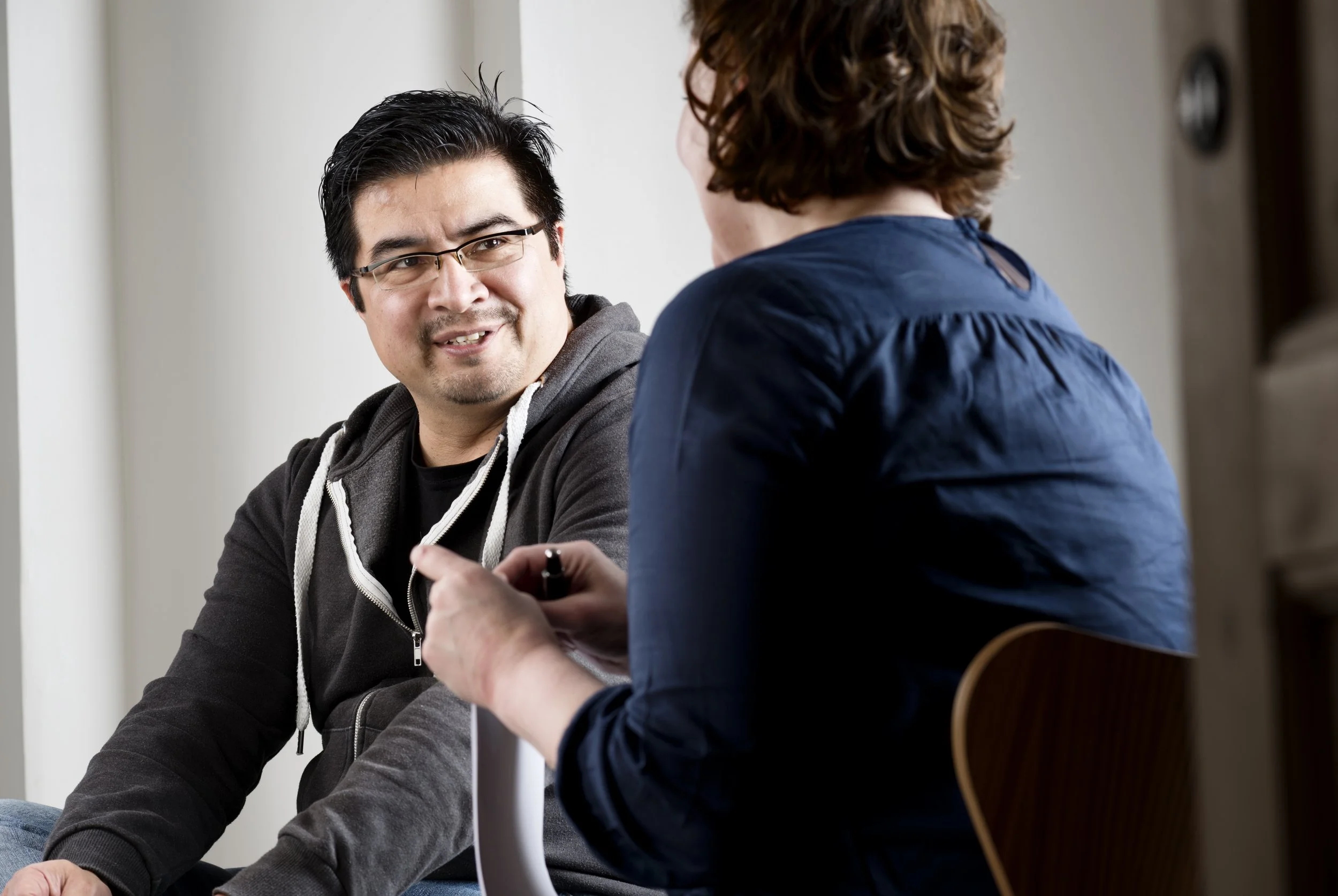 man and woman conversing