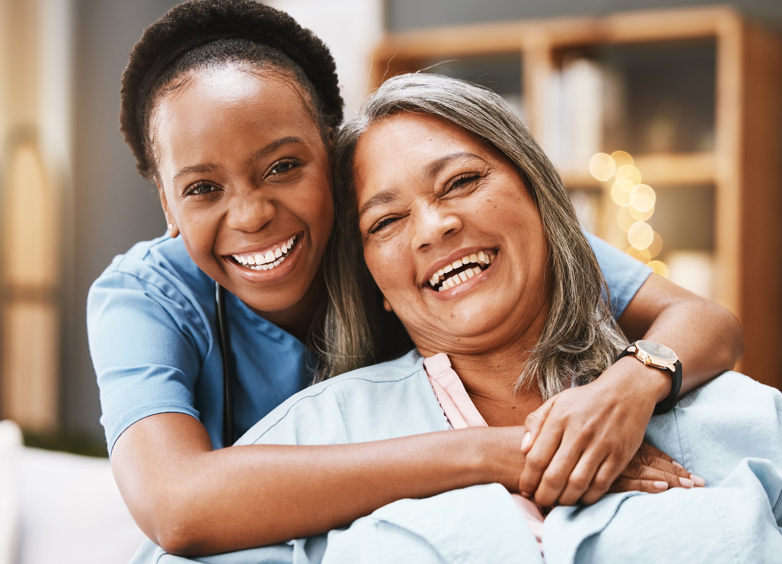 woman nurse hugging a client