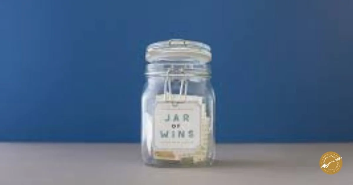 A glass jar labelled Jar of Wins on a blue background