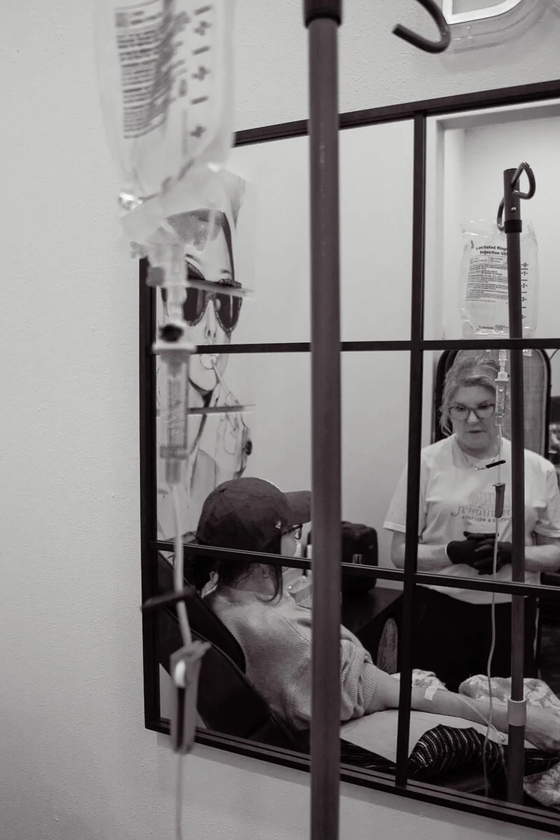 Susie giving a client an IV therapy treatment