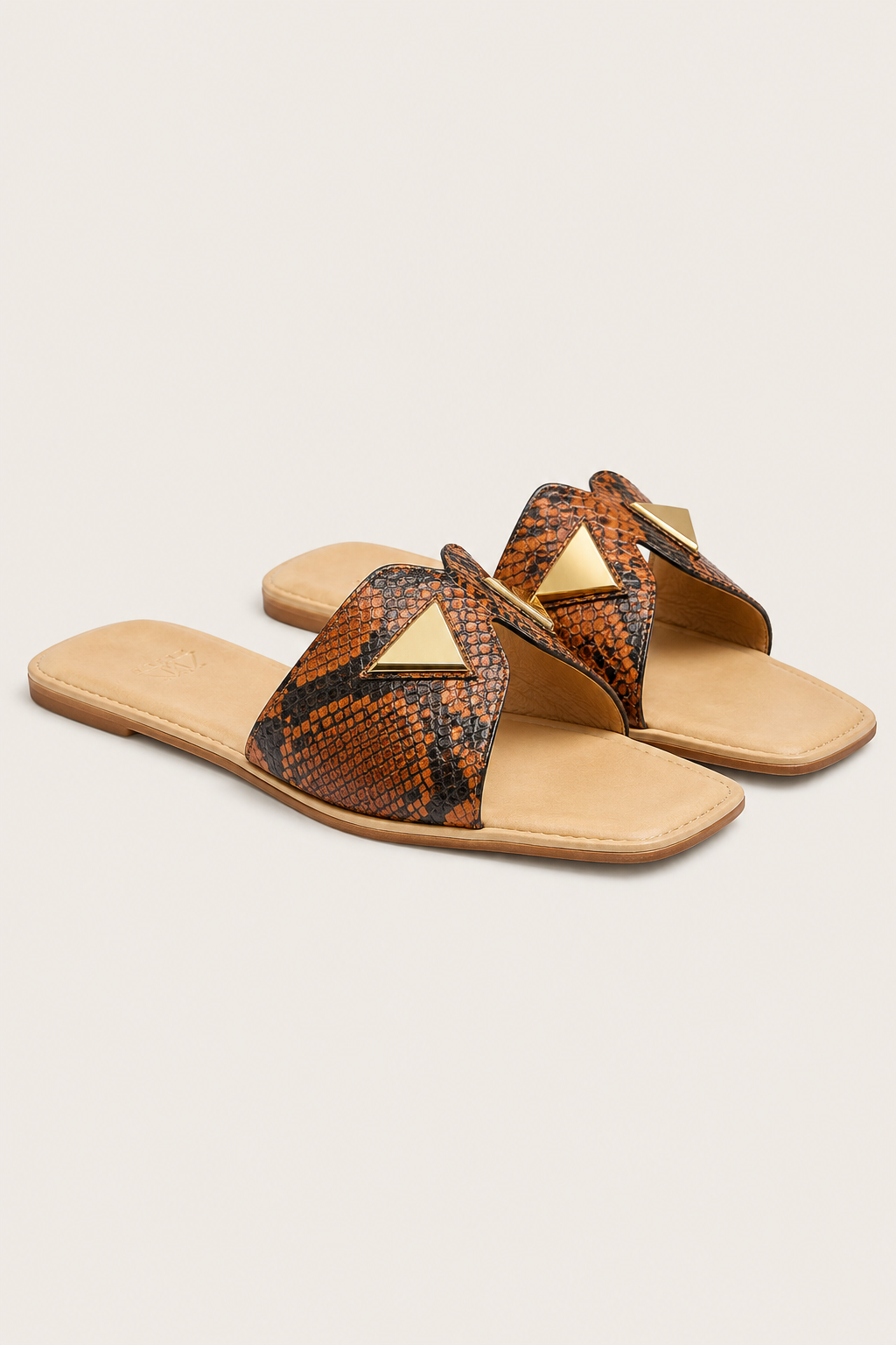 Minimalist snake-print sandals on soft backdrop.png (Copy)