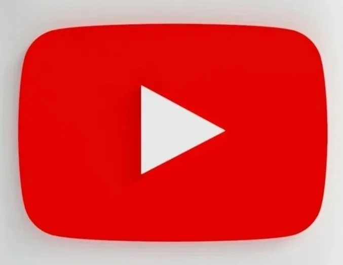 Close-up of the YouTube logo, a red rounded rectangle with a white play button in the center.