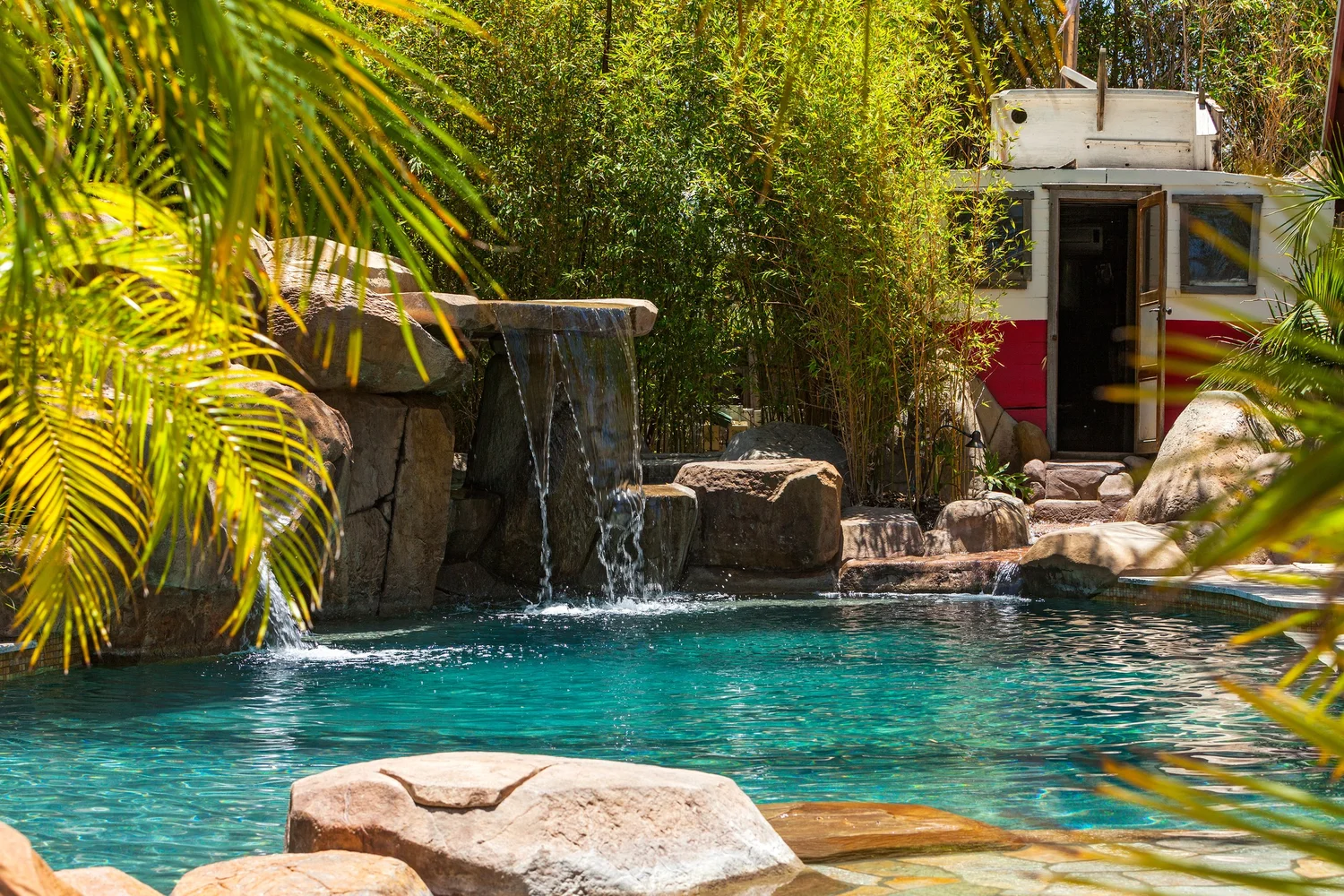 Waterfalls and a sailing-boat pool house in Dan Ramos’s nautical pool design