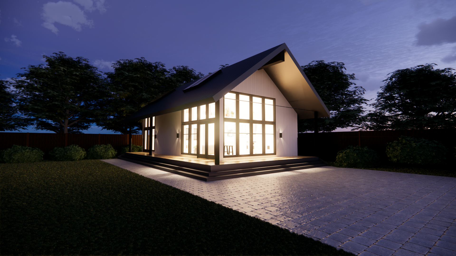 Modern house with large glass windows and warm interior lighting at dusk, surrounded by trees, with a paved pathway and steps leading to the entrance.