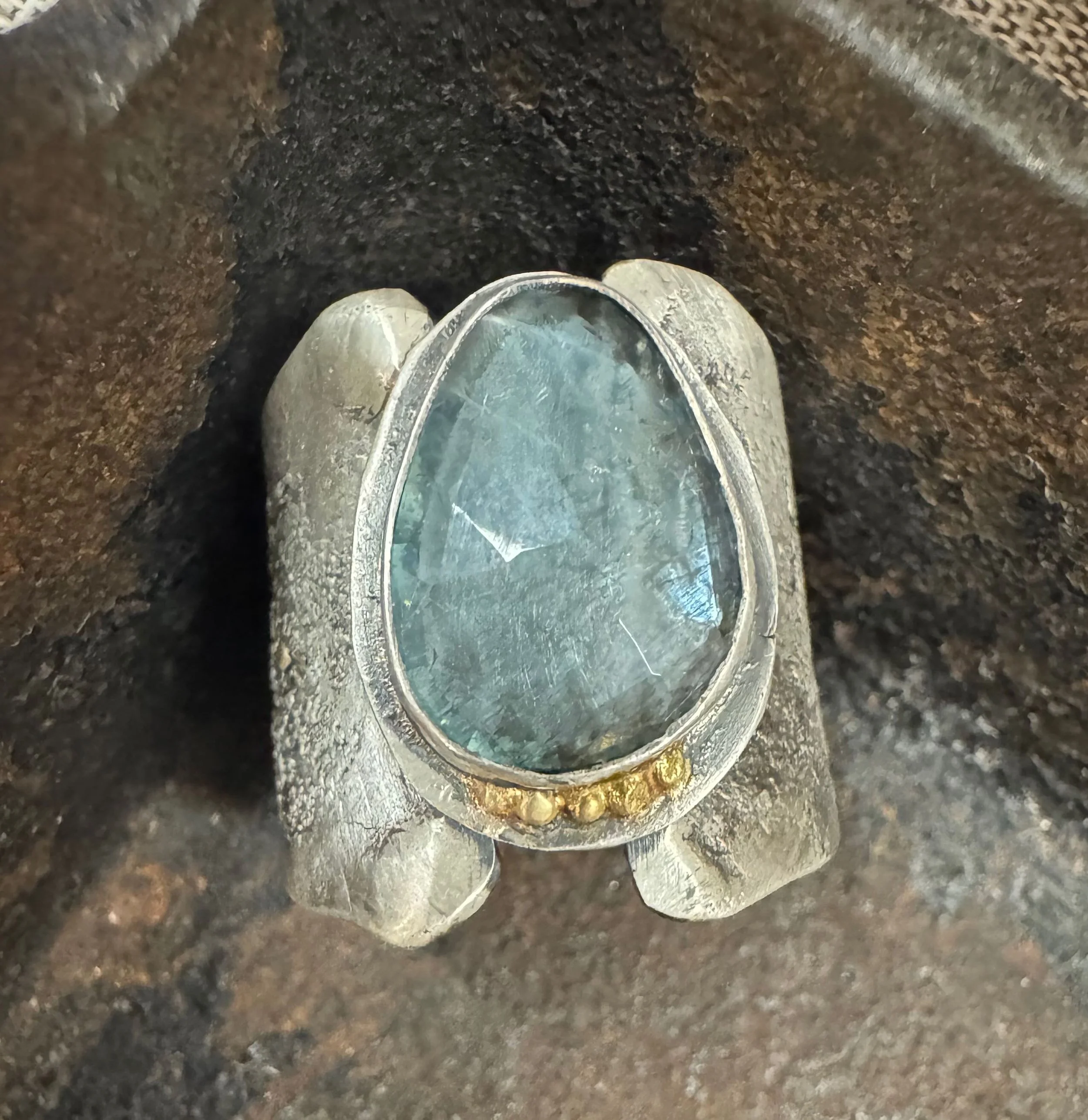 Aquamarine ring with gold accents