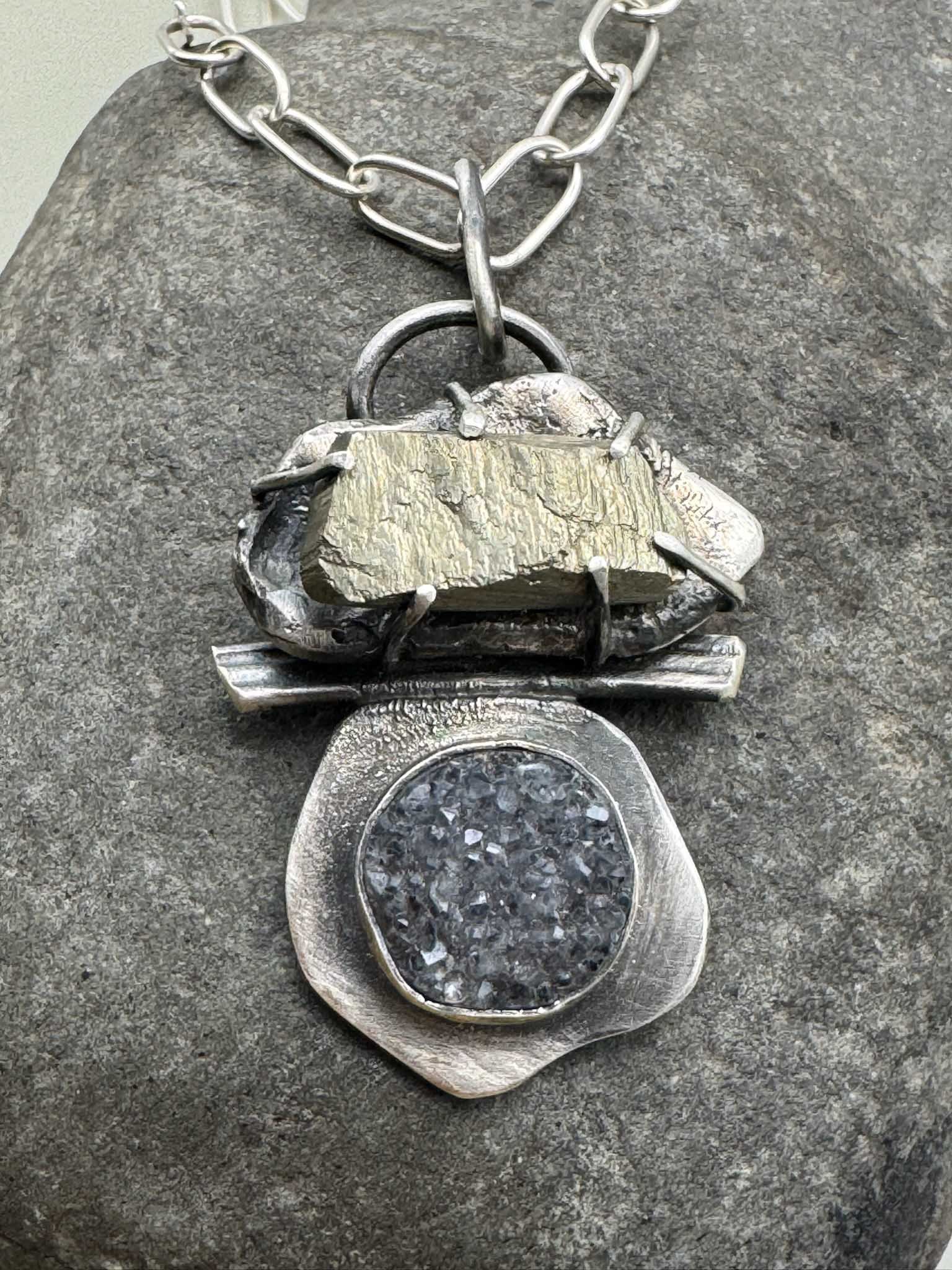 Pyrite and druzy pendant, hanging from a sterling silver handmade chain