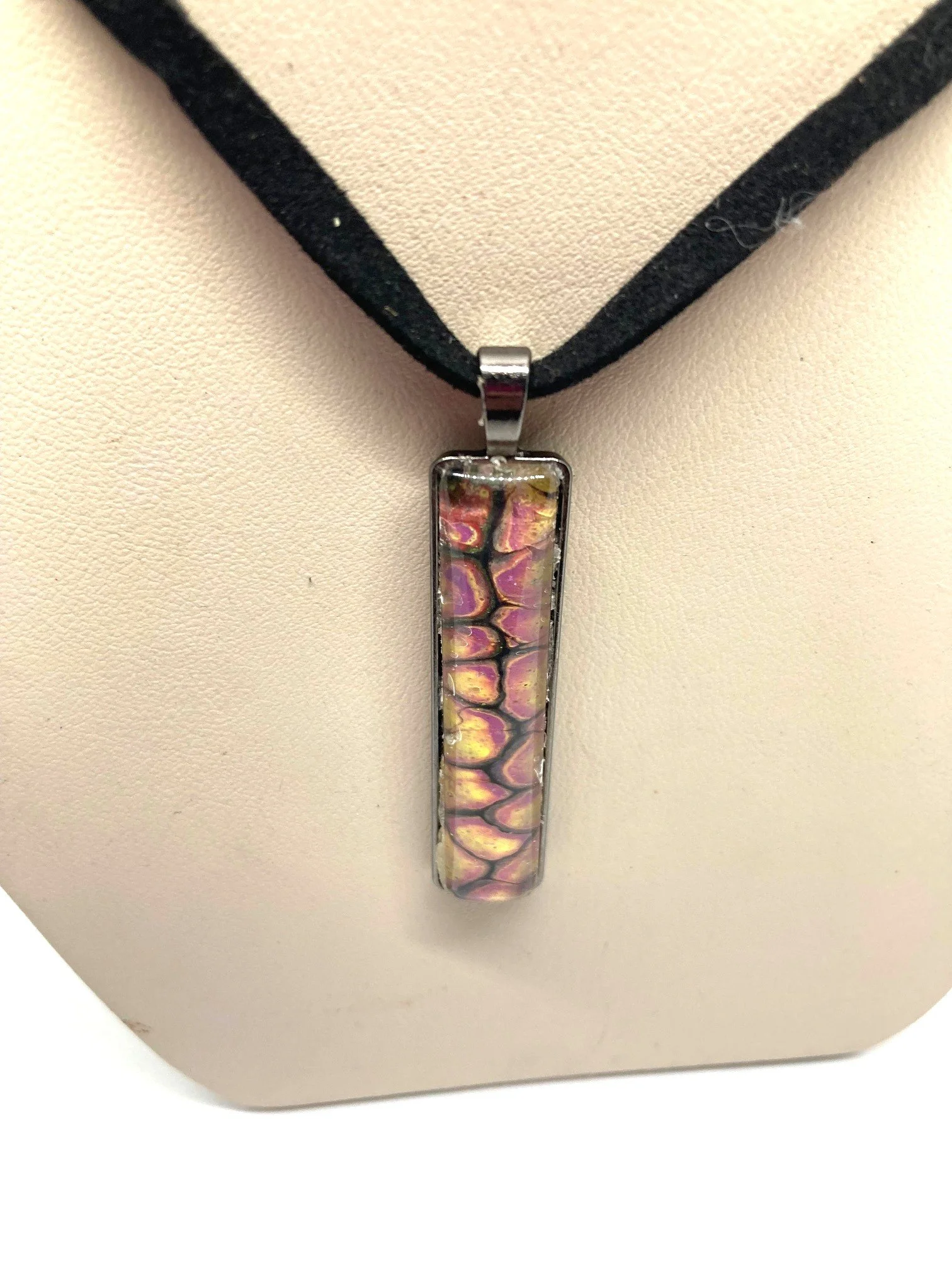 AcrylicPourNecklace_RectangleBezel_YellowndBlackChasmWithPink_CloseUp.jpg