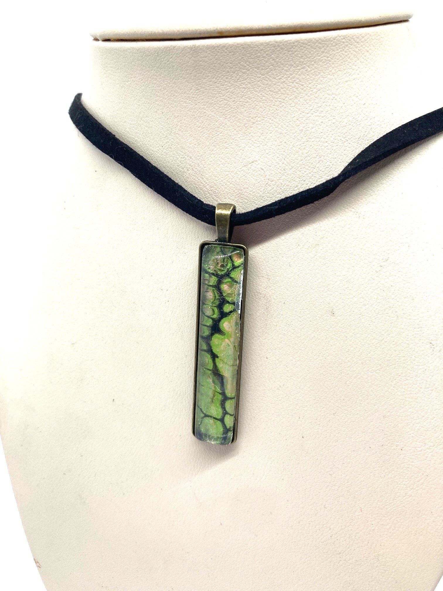 AcrylicPourNecklace_RectangleBezel_GreenandBlackChasmWithPink.jpg