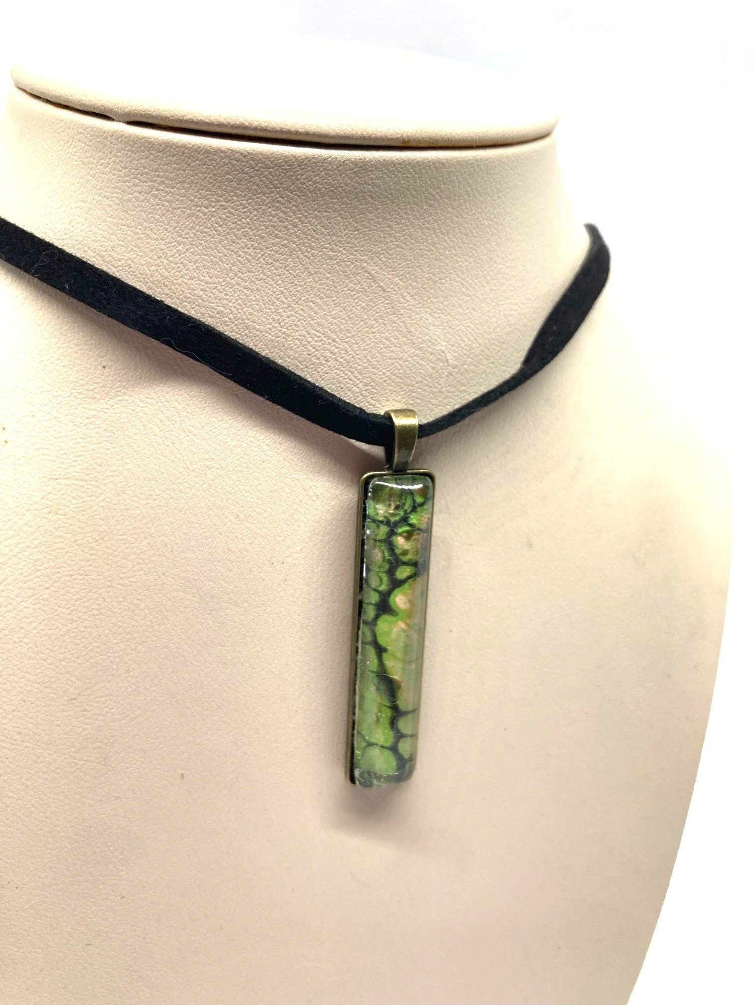 AcrylicPourNecklace_RectangleBezel_GreenandBlackChasmWithPink_Closer.jpg