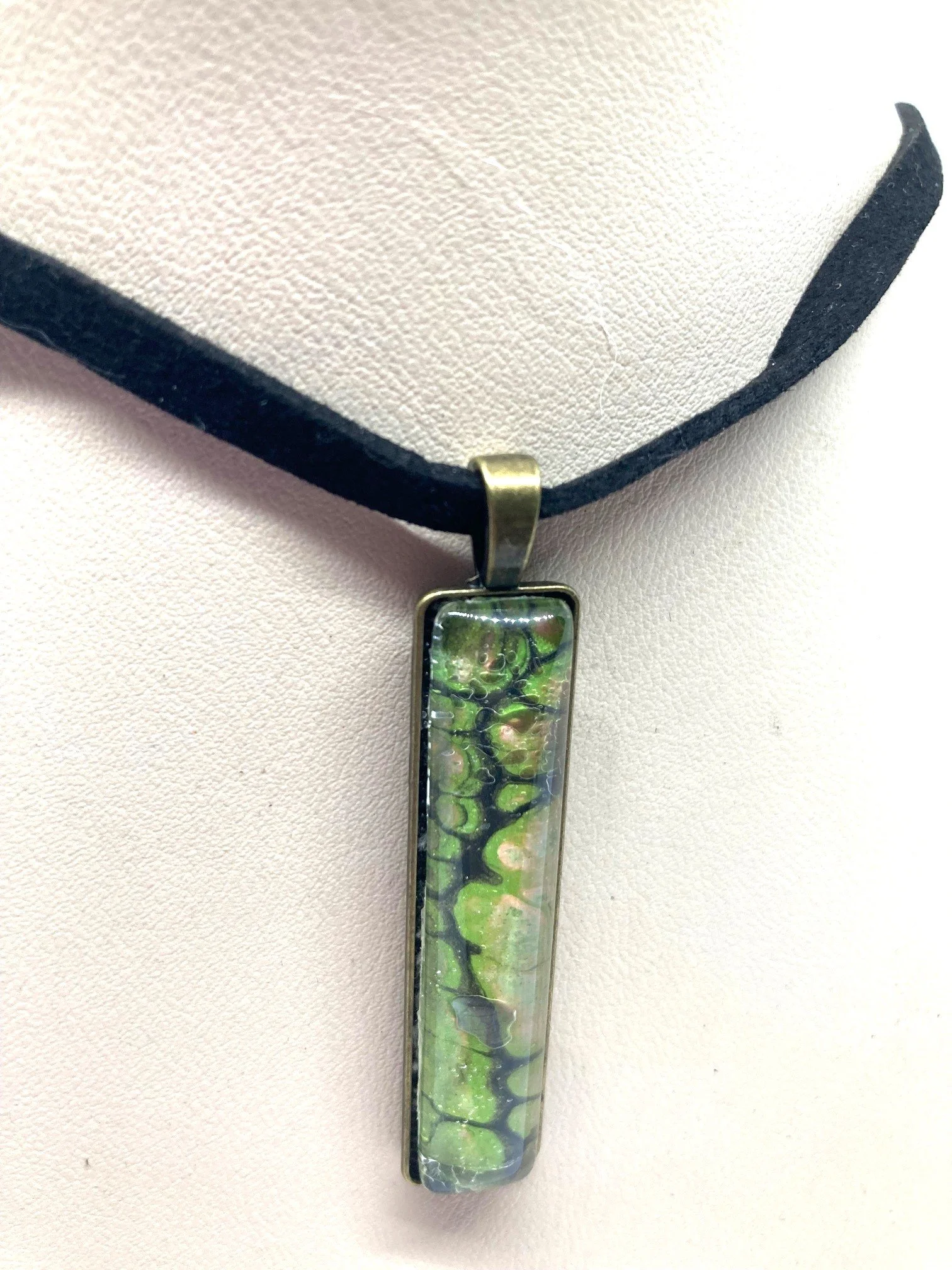 AcrylicPourNecklace_RectangleBezel_GreenandBlackChasmWithPink_Closer2.jpg