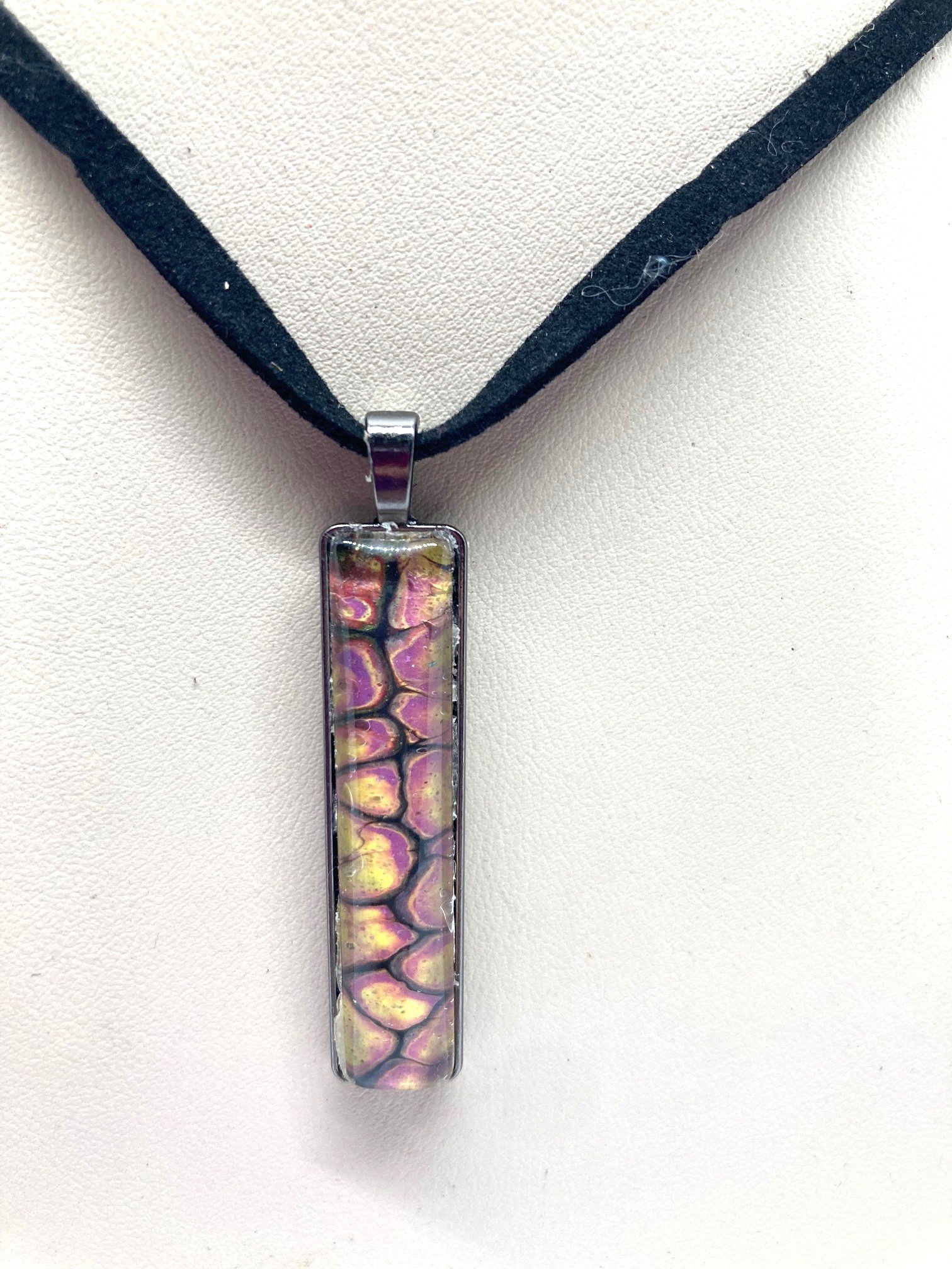 AcrylicPourNecklace_RectangleBezel_YellowndBlackChasmWithPink.jpg