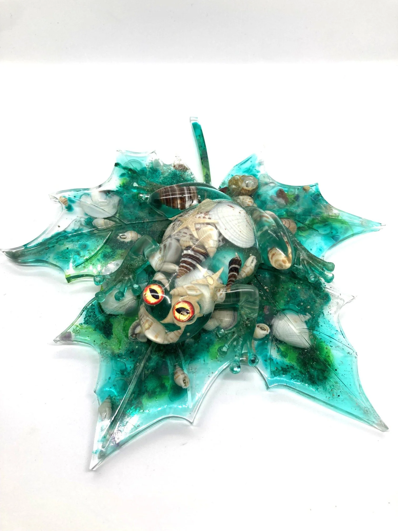 Resin Figurine "Shell Yeah" Hypno Frog with Shells on Large Shelled Leaf