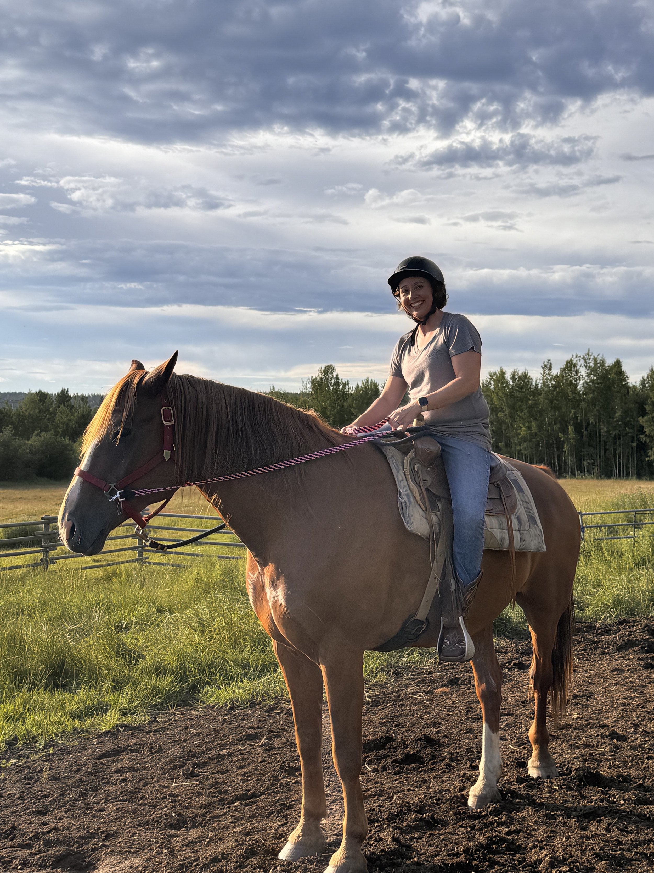 Guided horseback trail ride through the Cariboo wilderness near Big Lake, BC.