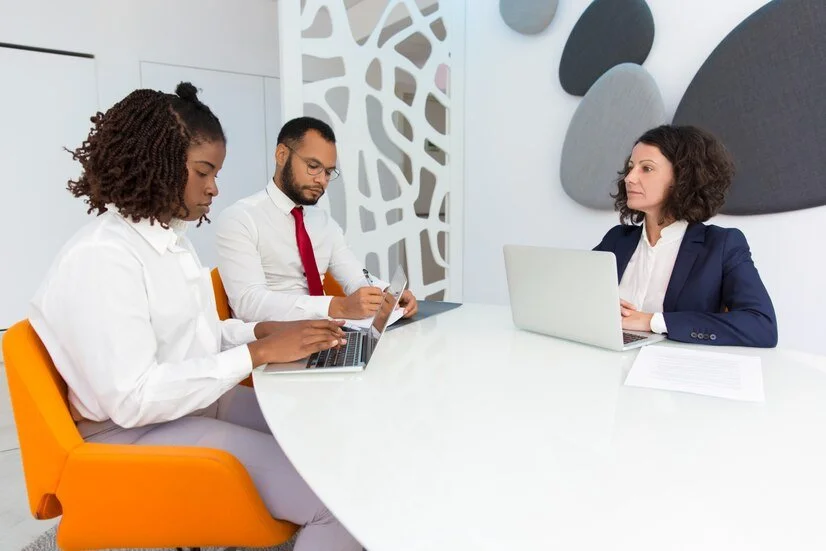 diverse-business-colleagues-reporting-female-boss_74855-1774.jpg