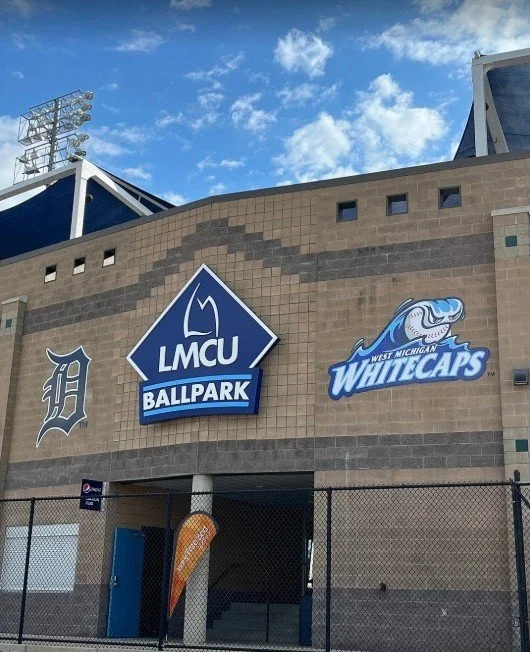 Cleaning Services Comstock Park, Michigan. Entrance of LMCU Ballpark with West Michigan Whitecaps signage.