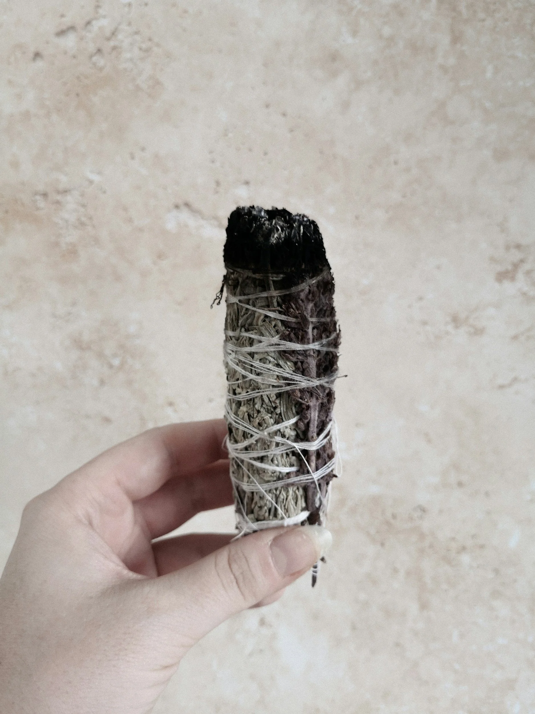 An abstract outline icon with geometric and diagonal lines across a circle shape.