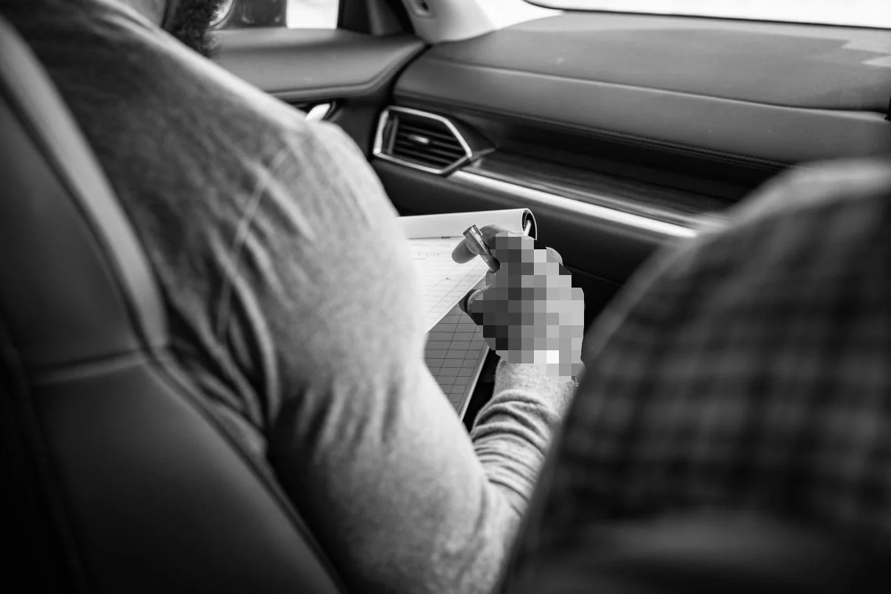 covert surveillance operator making notes