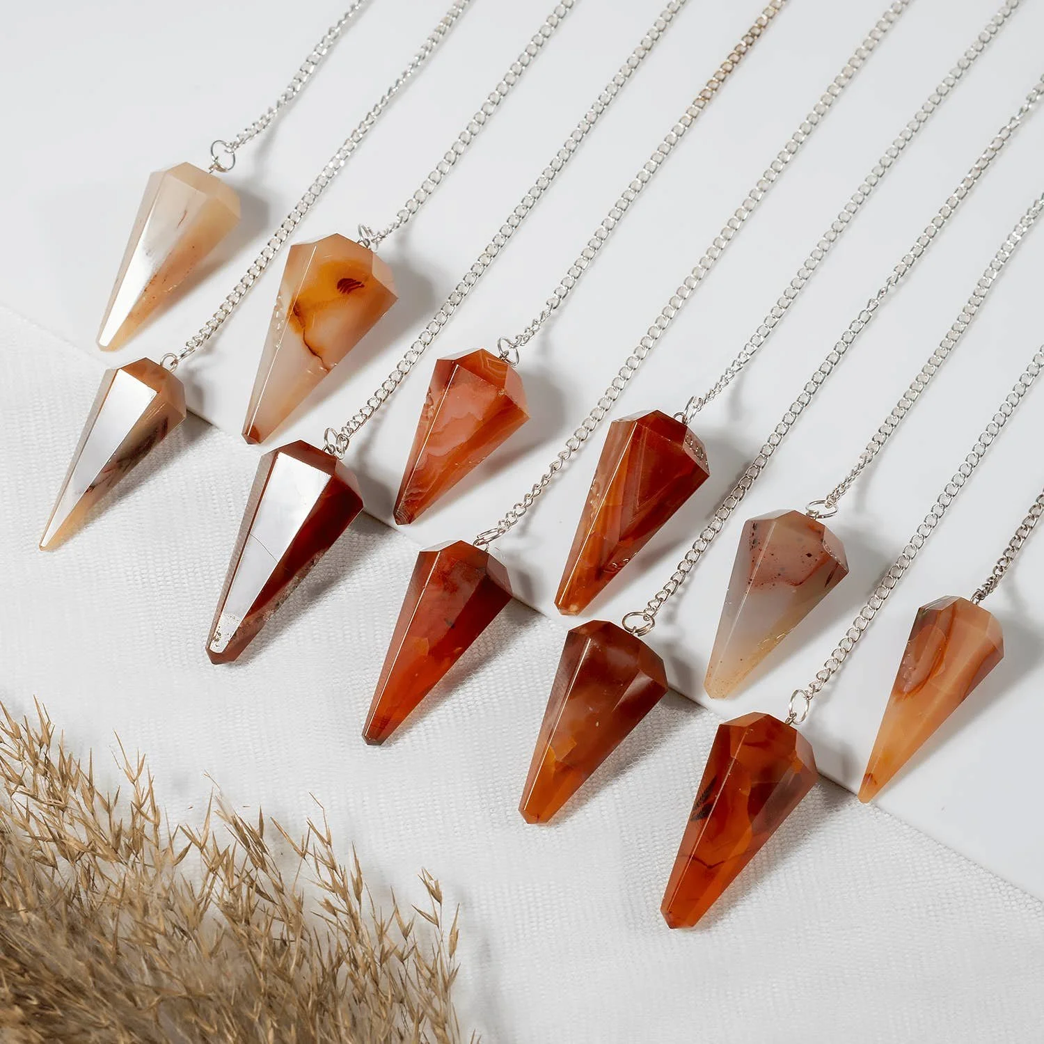 gemstone-dowsing-pendulum-chakra-healing-tool-reiki-tool-carnelian.jpg