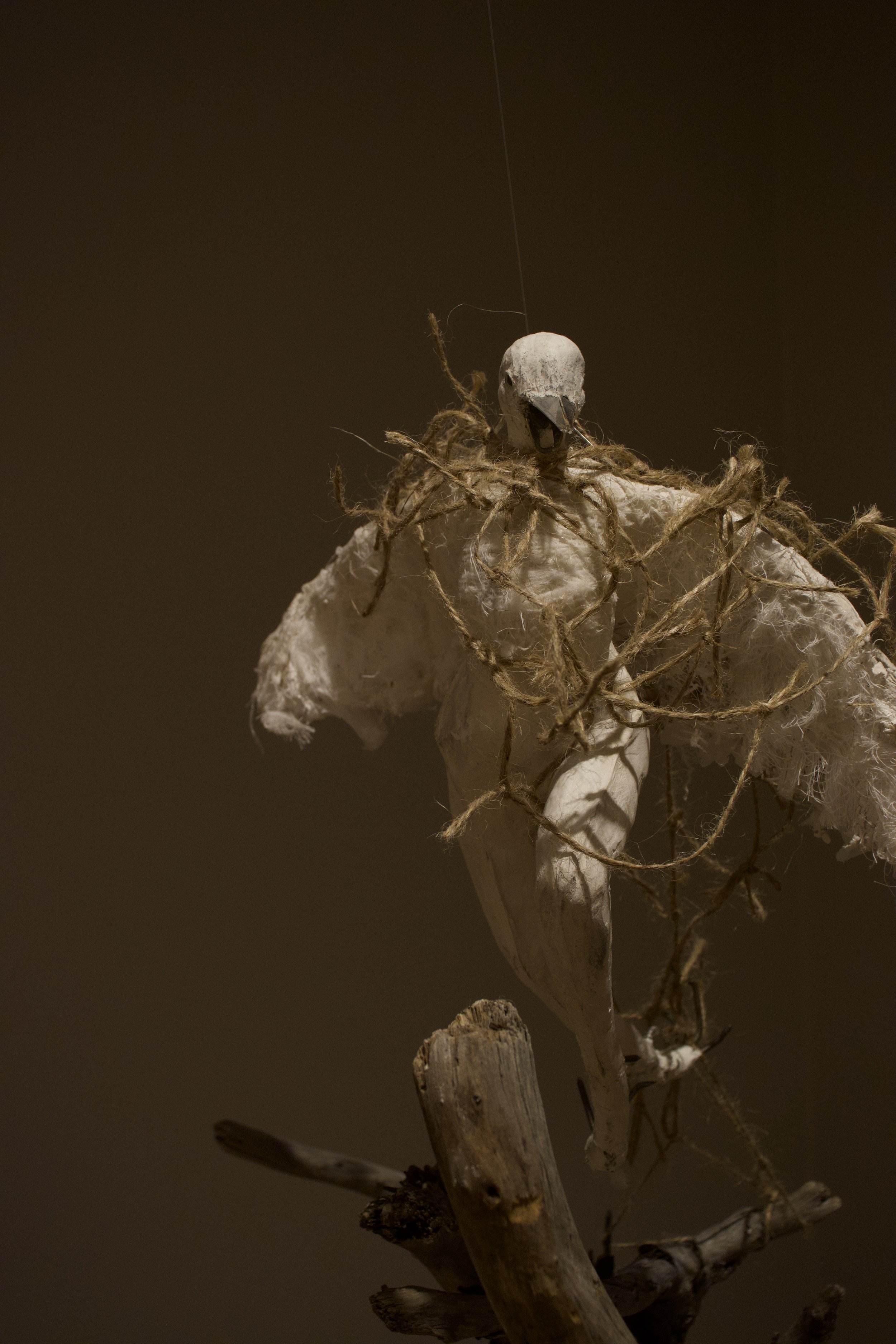 "The Crow" (2025) materials: aluminum wire, discarded plastic bags, yarn, cotton gauze, plaster, paper clay, mixed metals, charcoal
