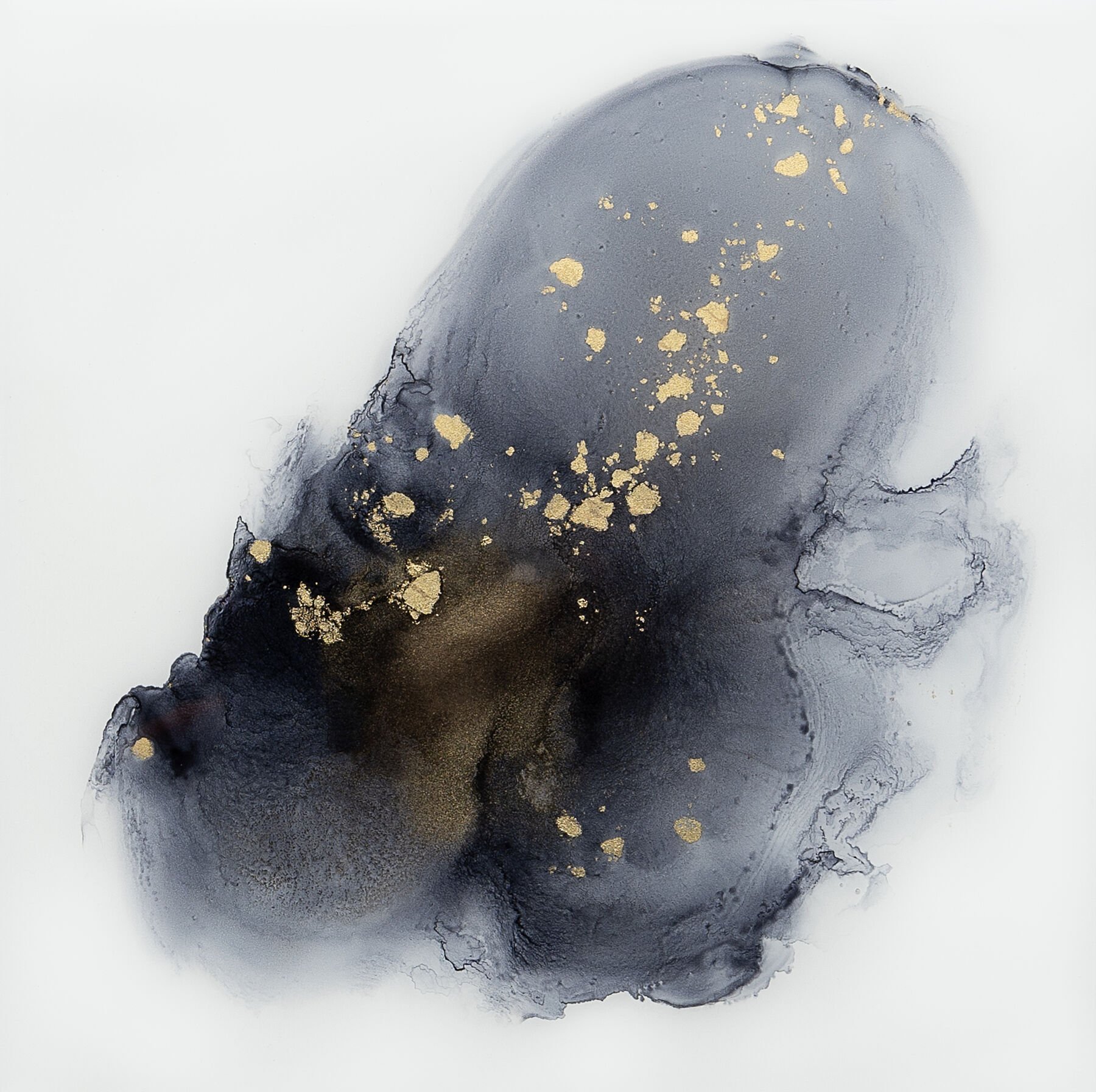 Abstract black and gold ink or watercolor with flowing, cloudy shapes and gold splatters on a white background.